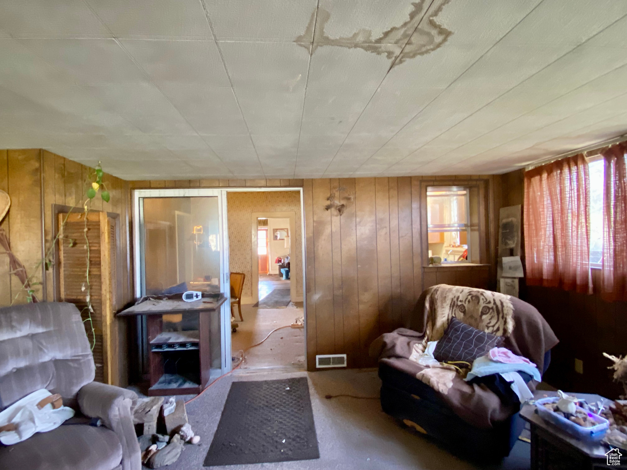 Living room with wood walls