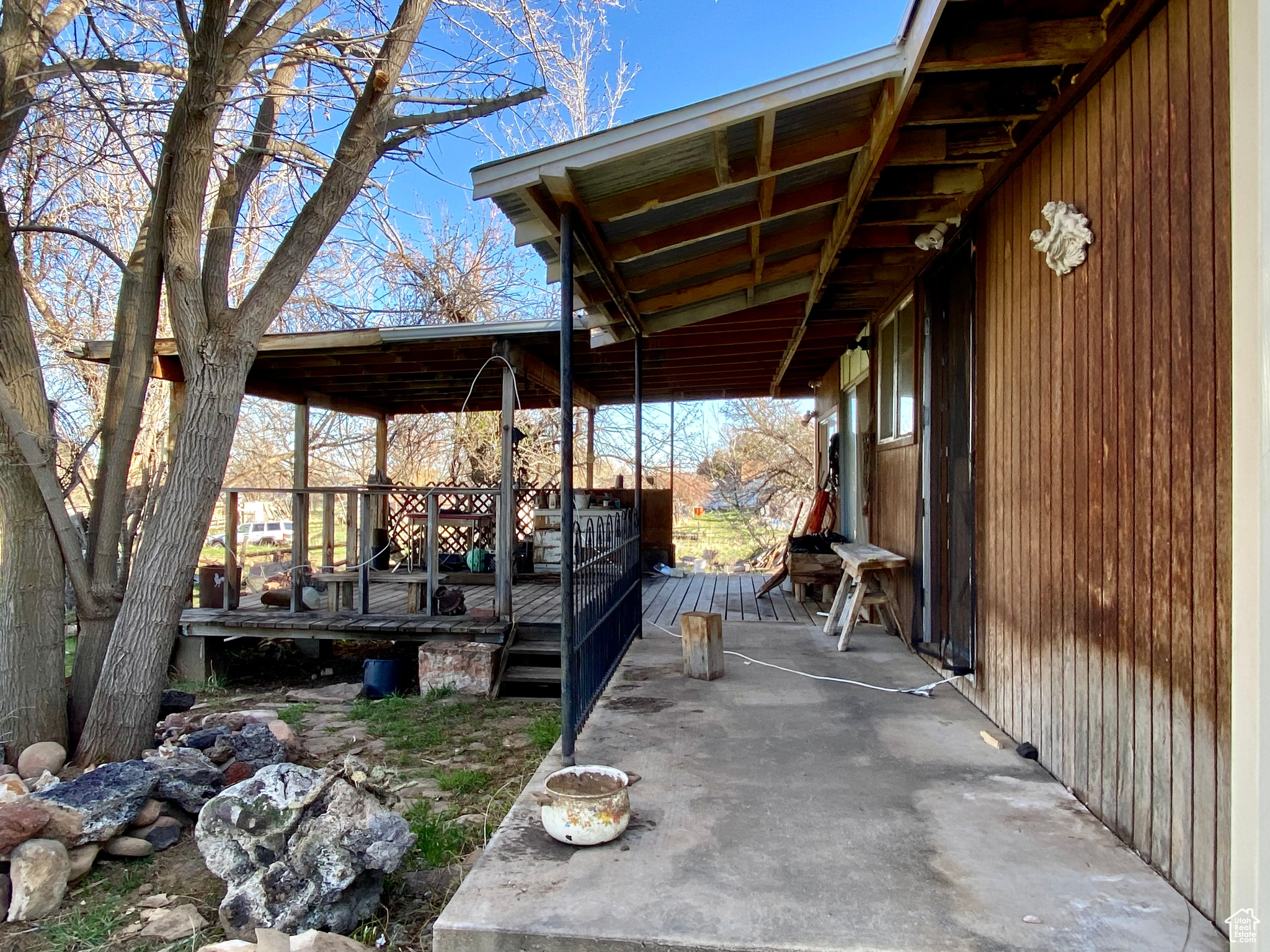 View of patio with a wooden deck