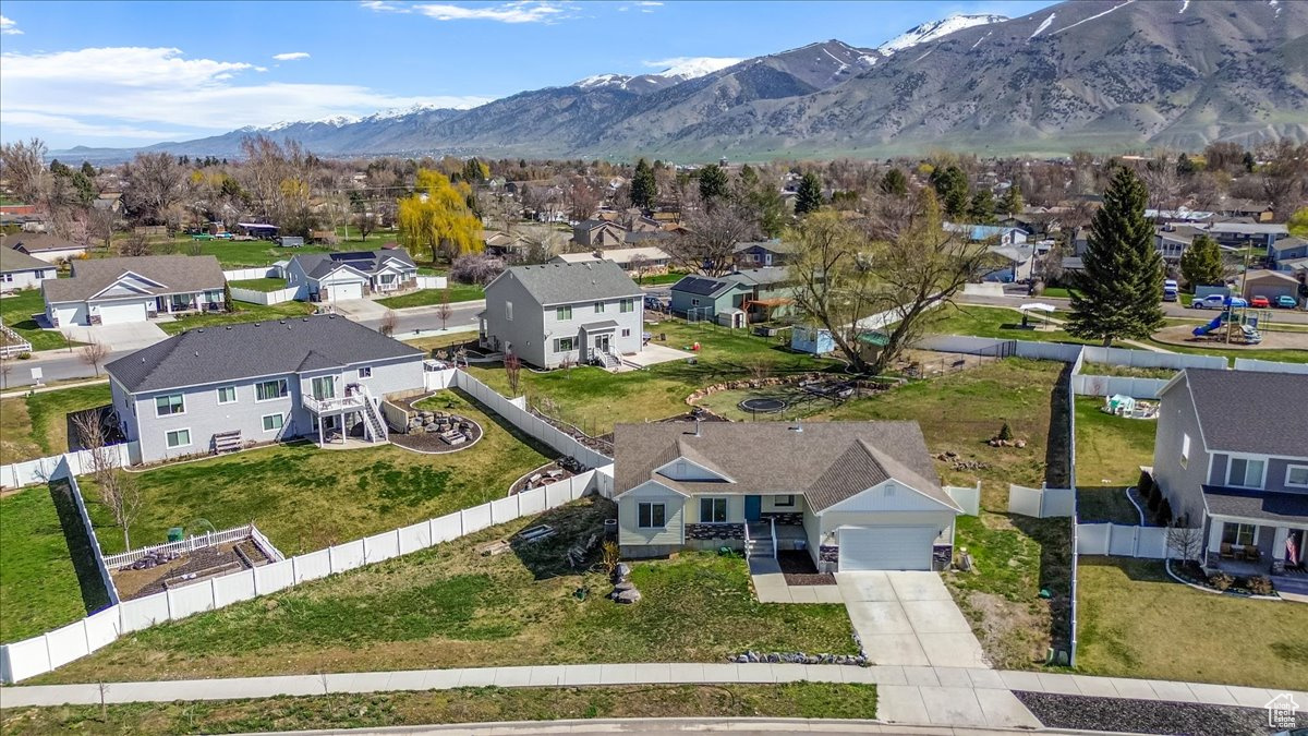 Birds eye view of property with a mountain view