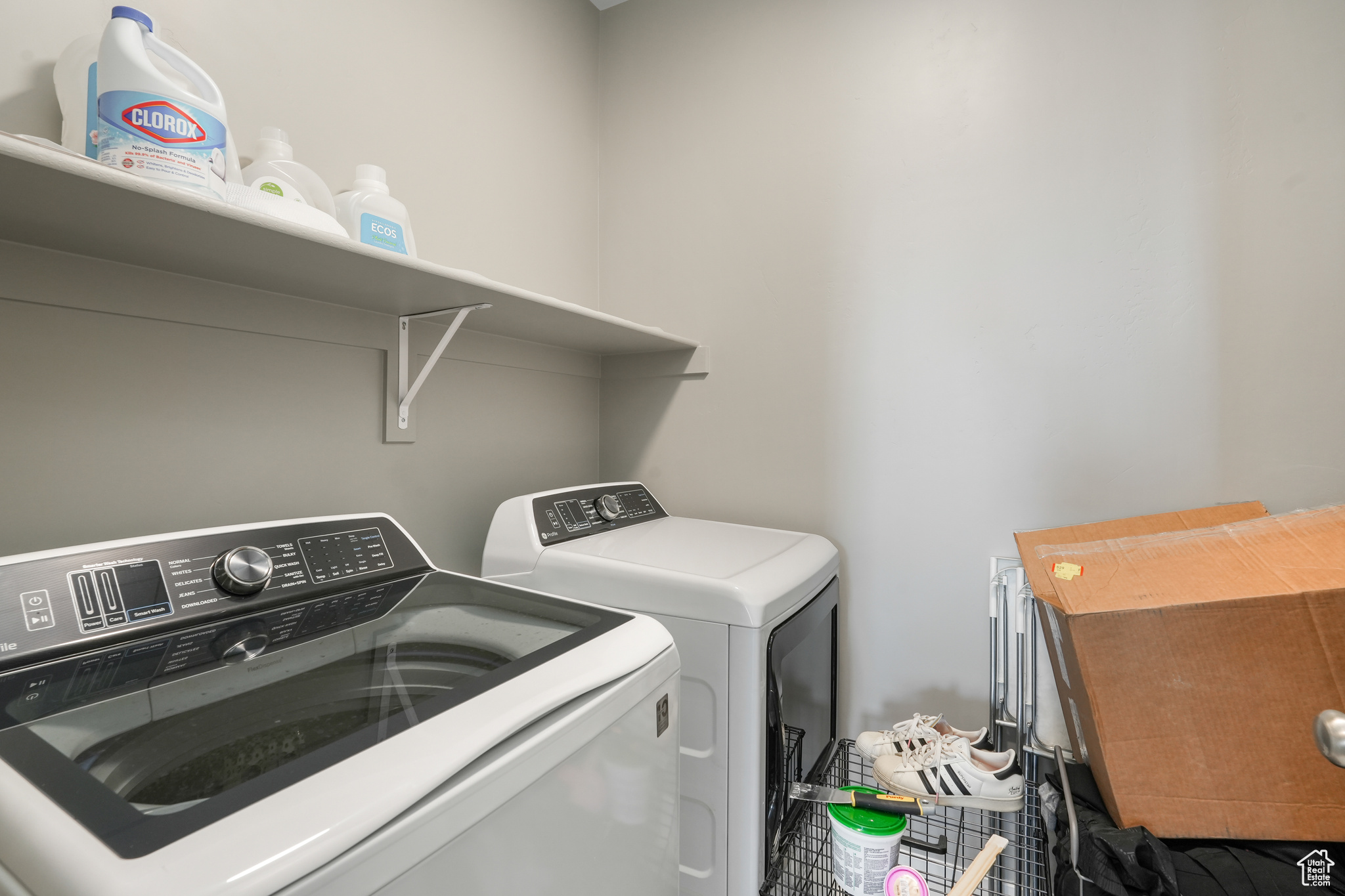 Laundry area featuring washing machine and clothes dryer