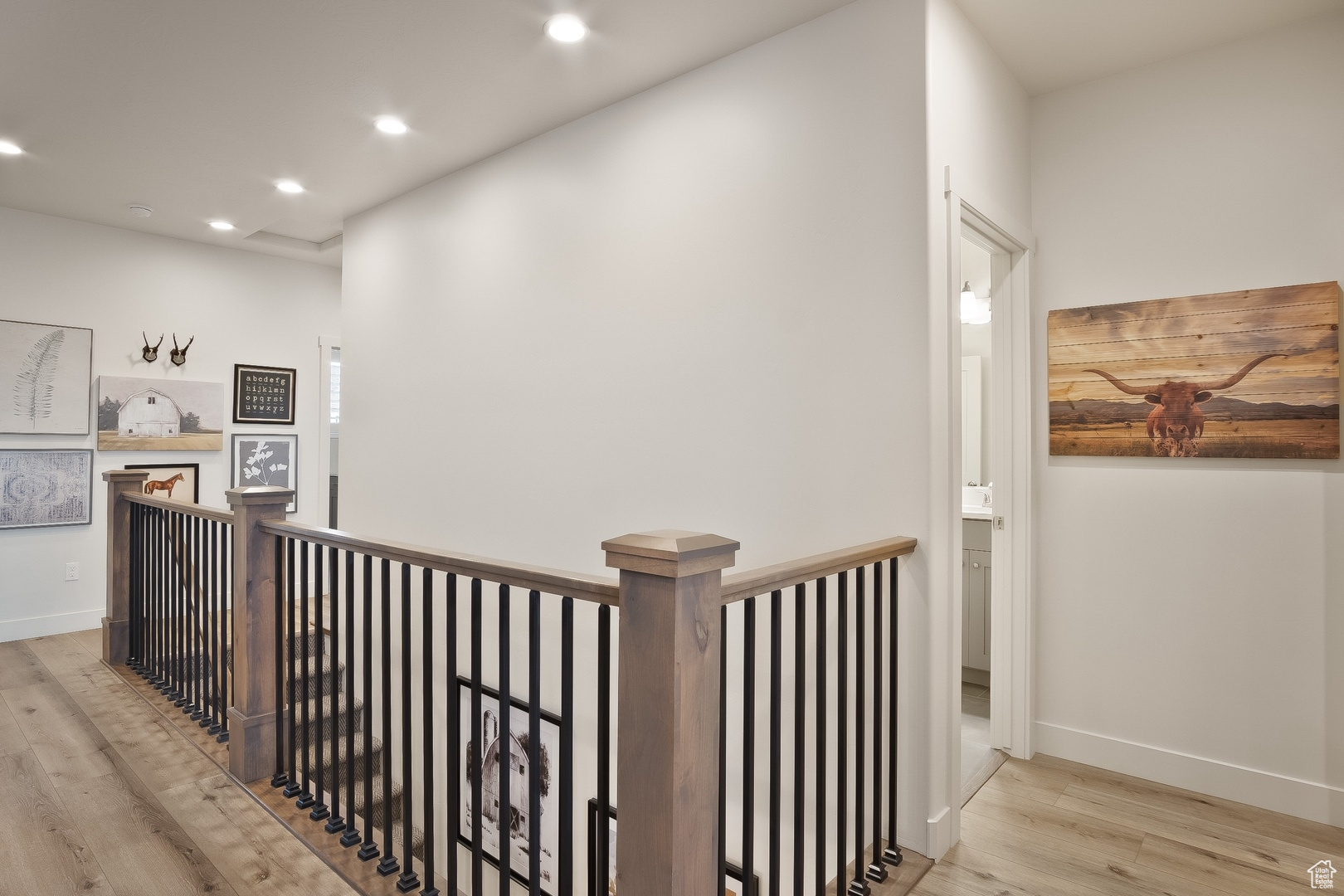 Hall featuring light hardwood / wood-style flooring