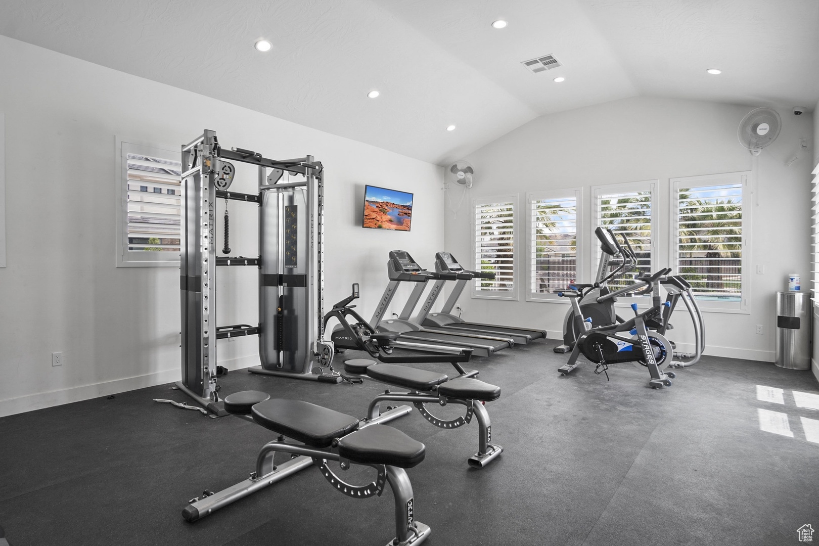 Gym with vaulted ceiling