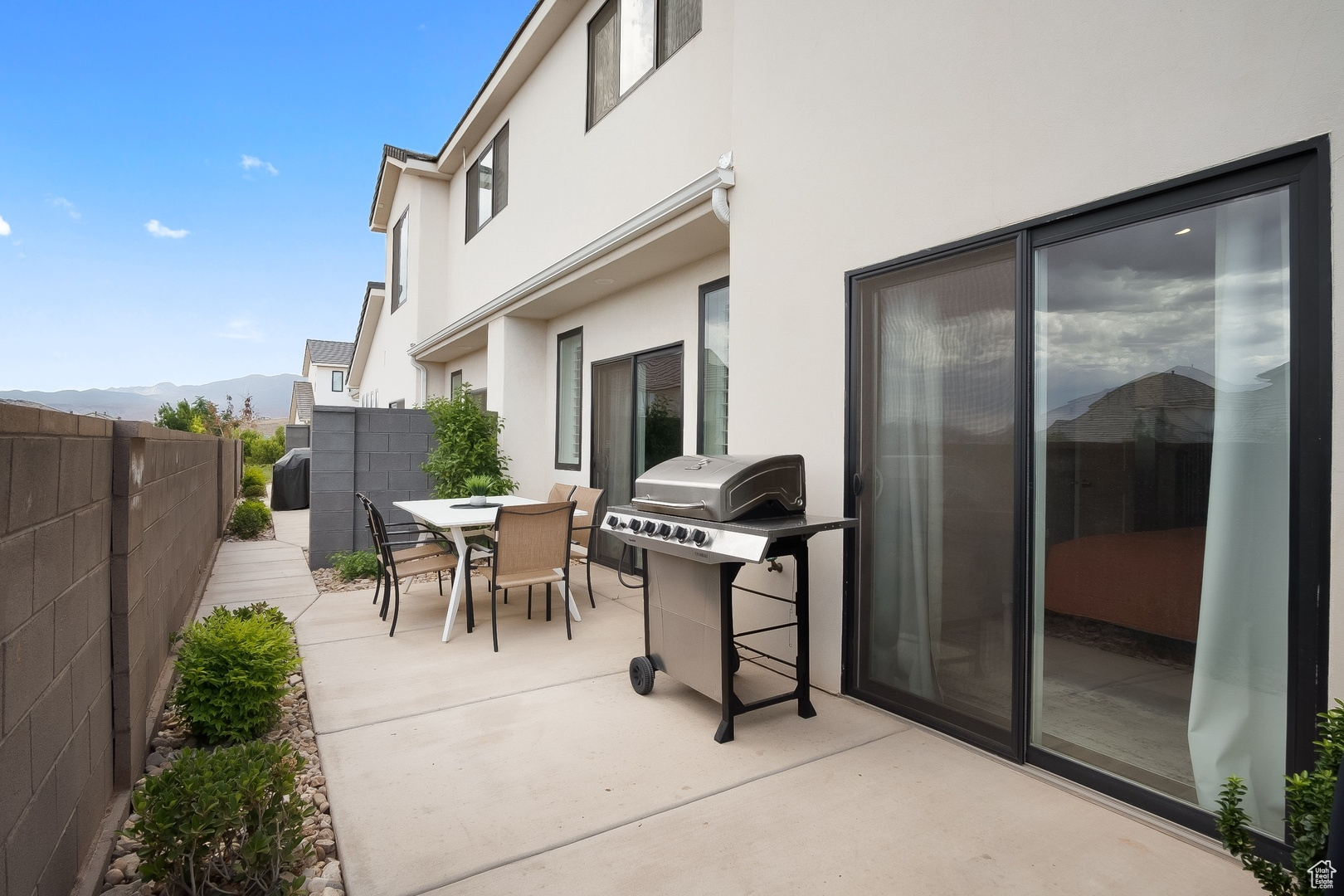 View of patio / terrace with a grill and a mountain view