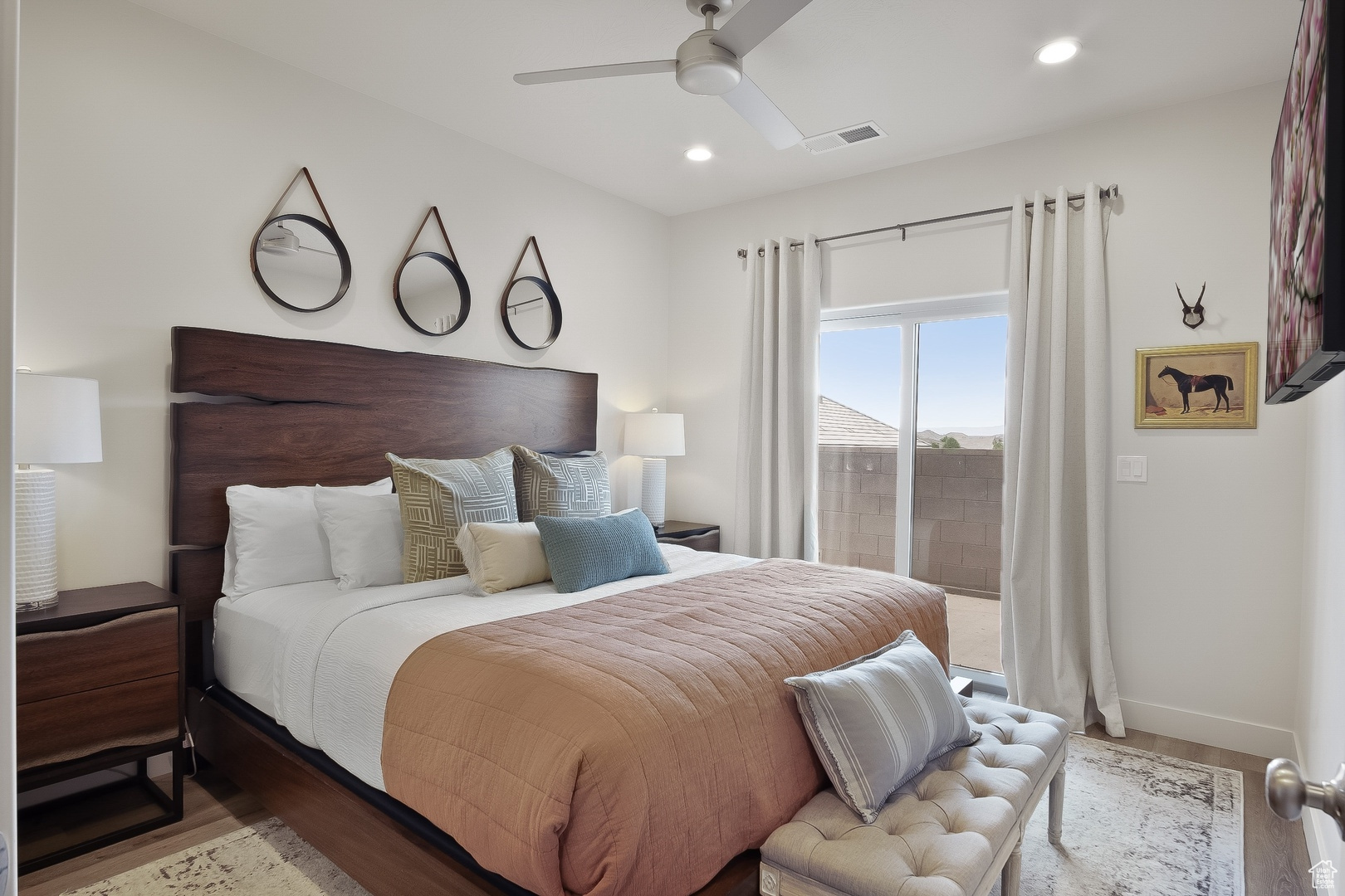 Bedroom with ceiling fan and light hardwood / wood-style floors