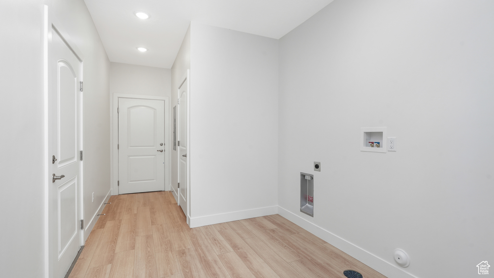 Laundry room with additional storage.