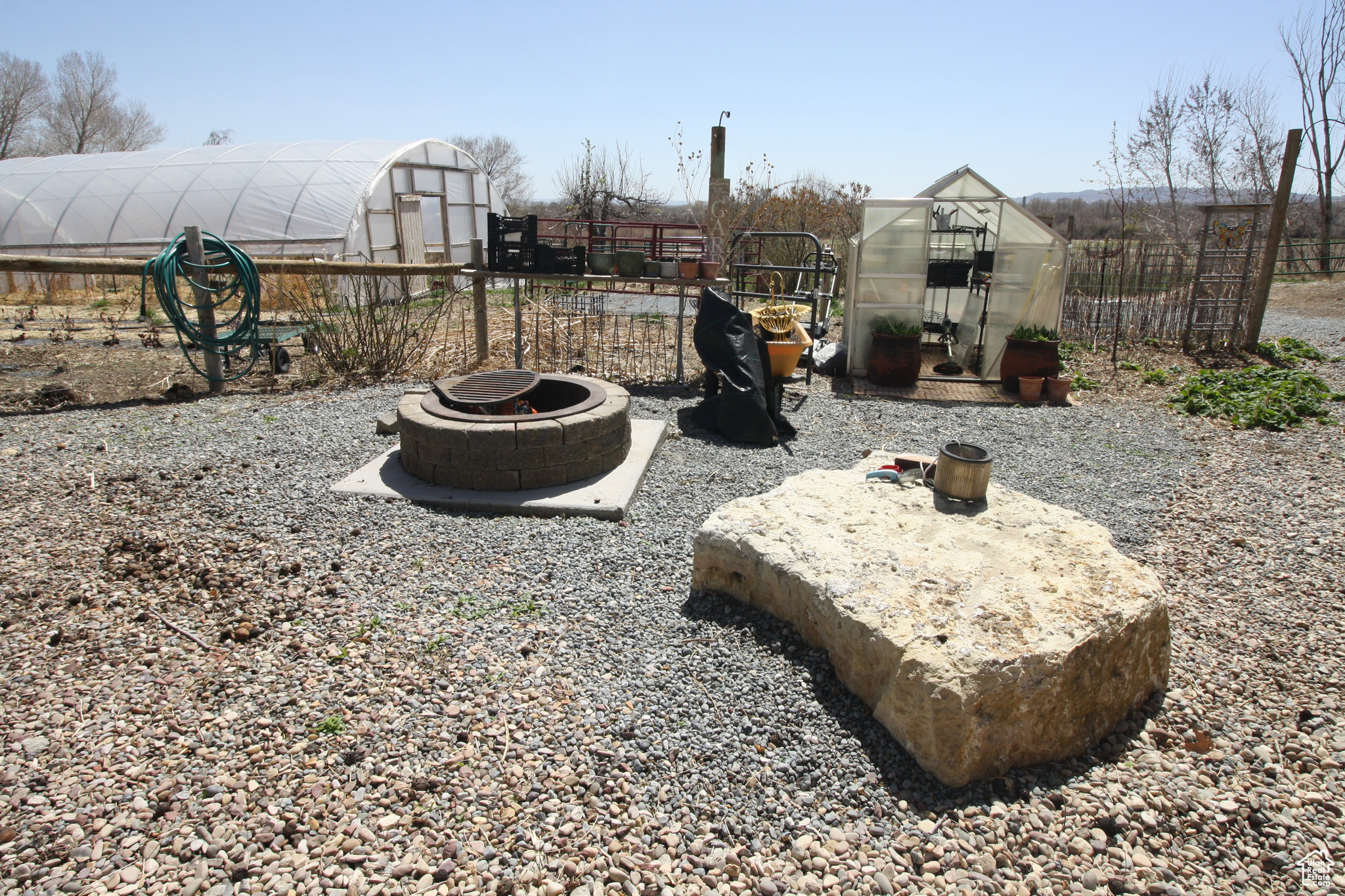 View of yard featuring an outdoor fire pit and an outdoor structure