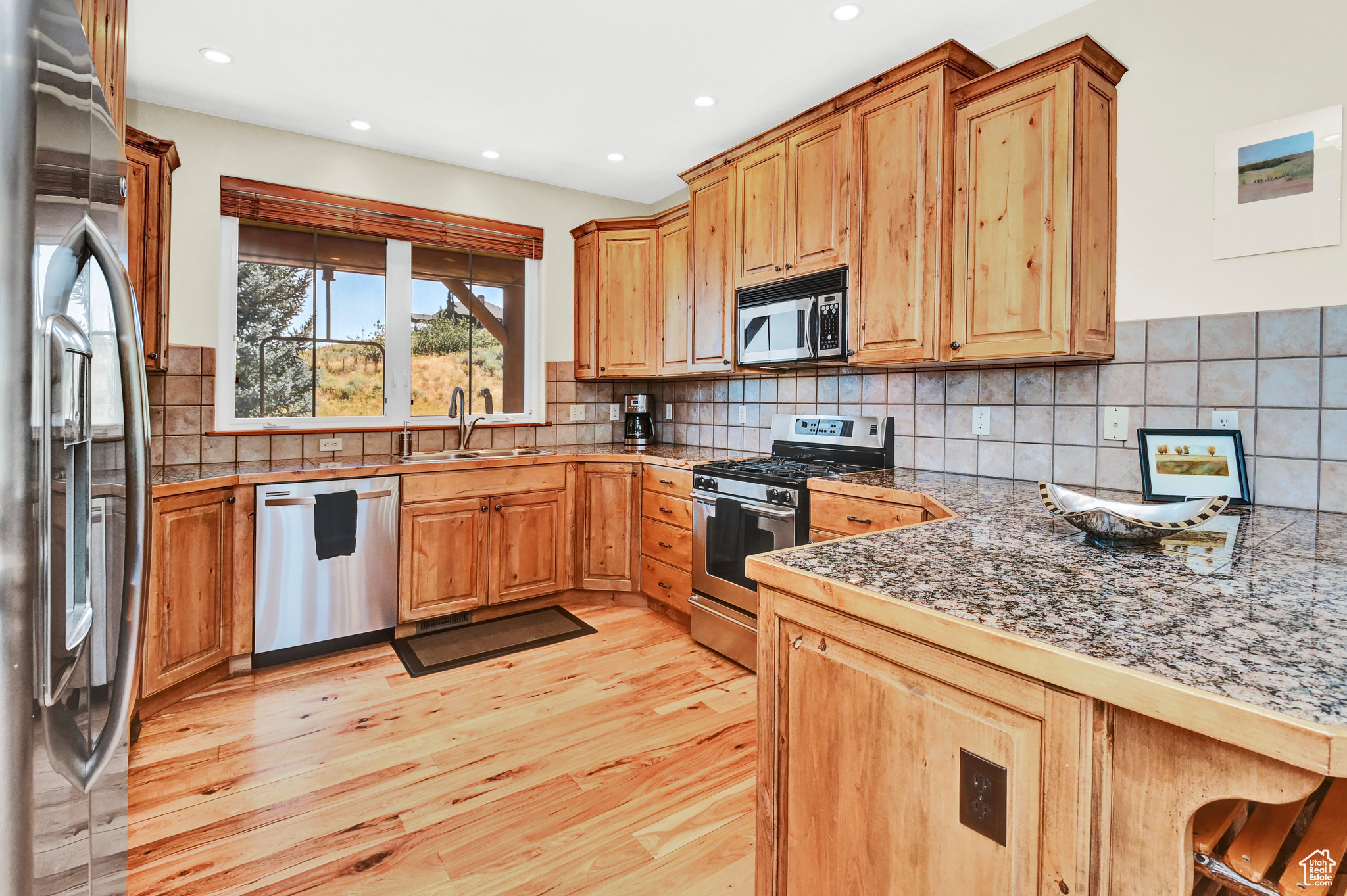 Stainless steel appliances, alder cabinets including pantry cabinets and lazy susans.