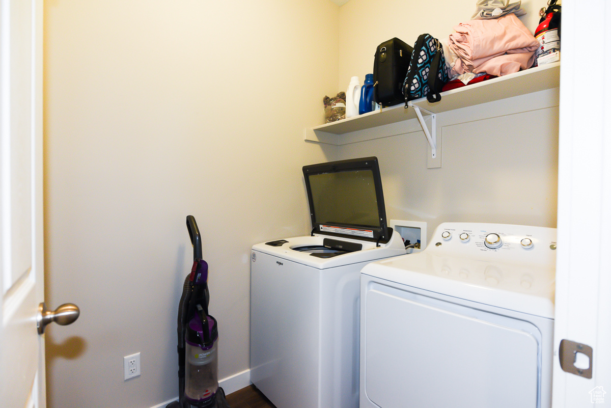 Clothes washing area with washer hookup and washer and clothes dryer