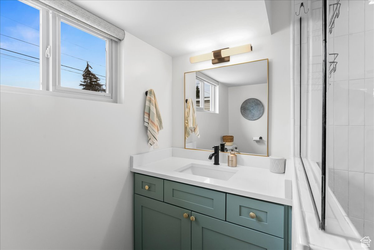 Bathroom with plenty of natural light and oversized vanity