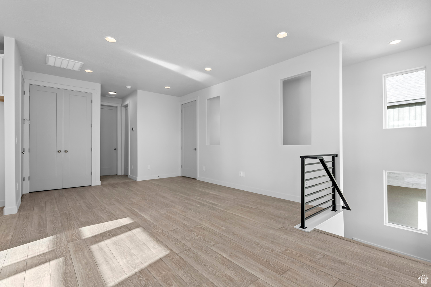Unfurnished room featuring light wood-type flooring