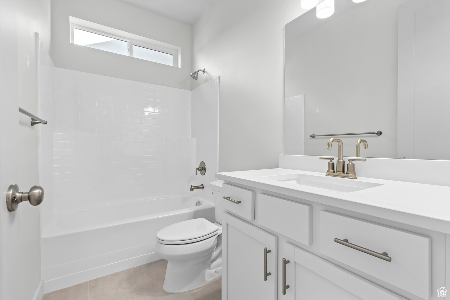 Full bathroom with vanity, toilet, shower / bathtub combination, and tile flooring