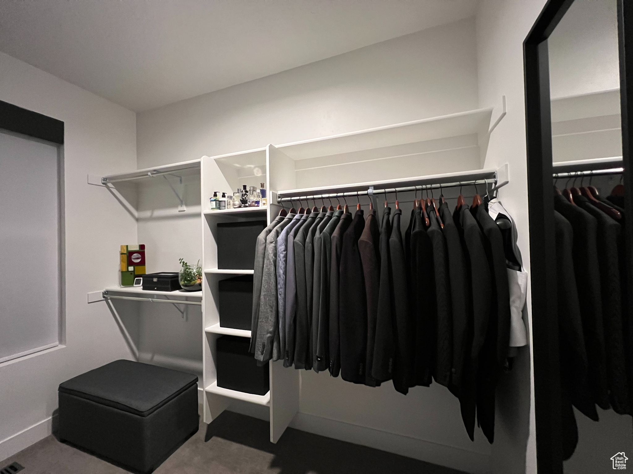 Primary bedroom walk-in closet