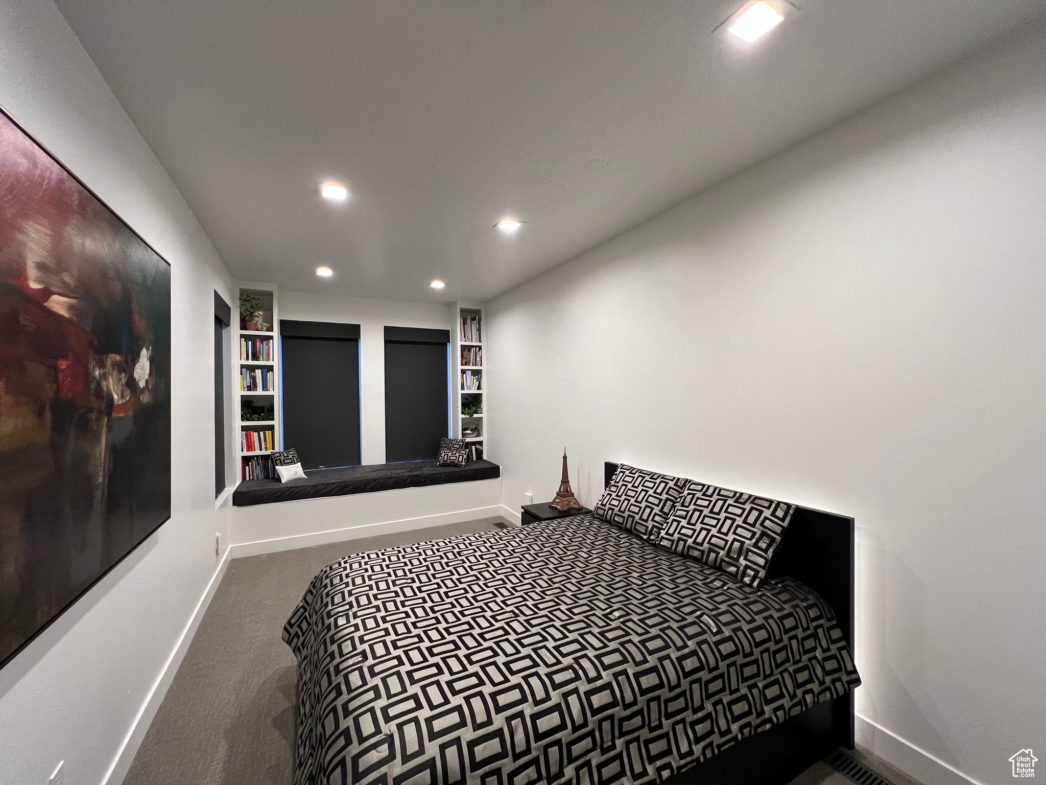 Guest bedroom with storage in custom window seat