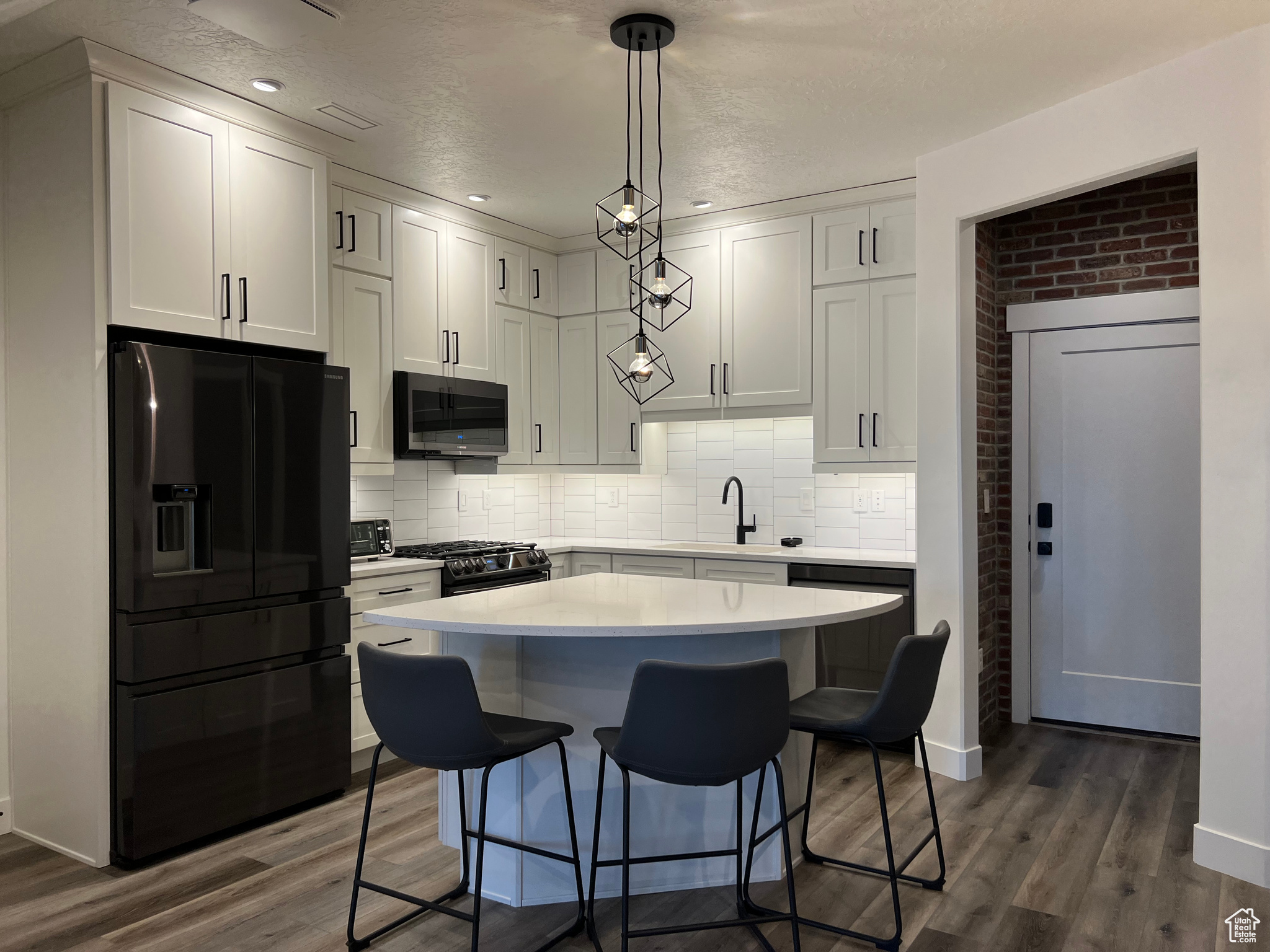 Island seating with decorative chandelier