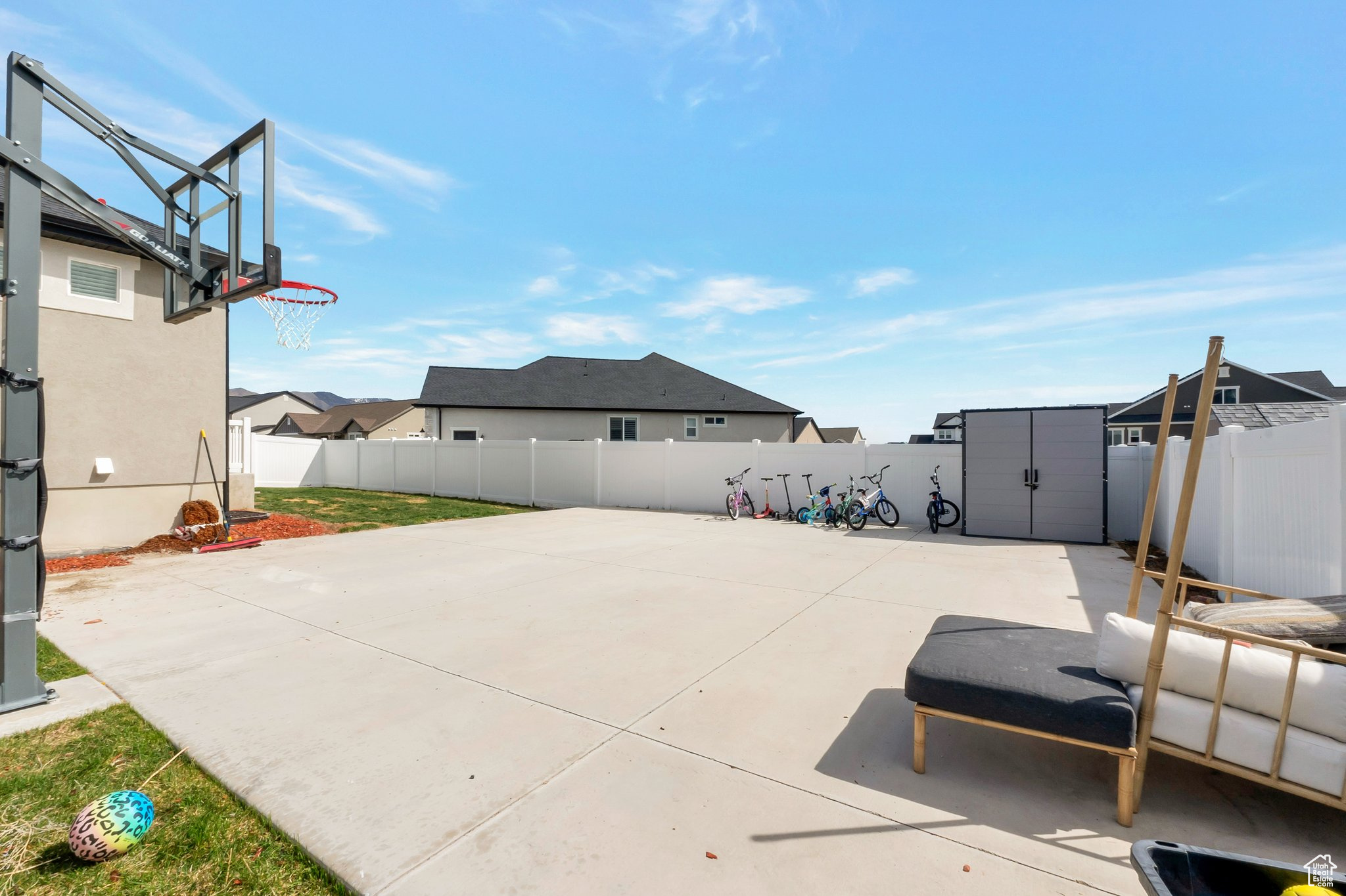 View of patio / terrace featuring basketball court and a shed