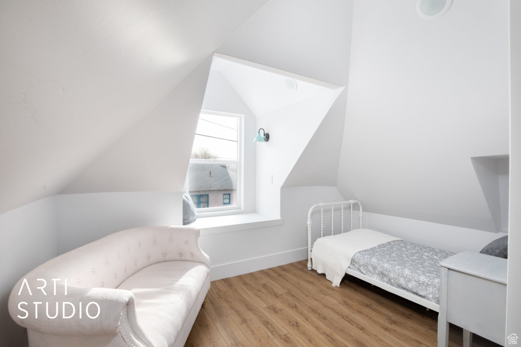 Bedroom featuring light hardwood / wood-style flooring and lofted ceiling
