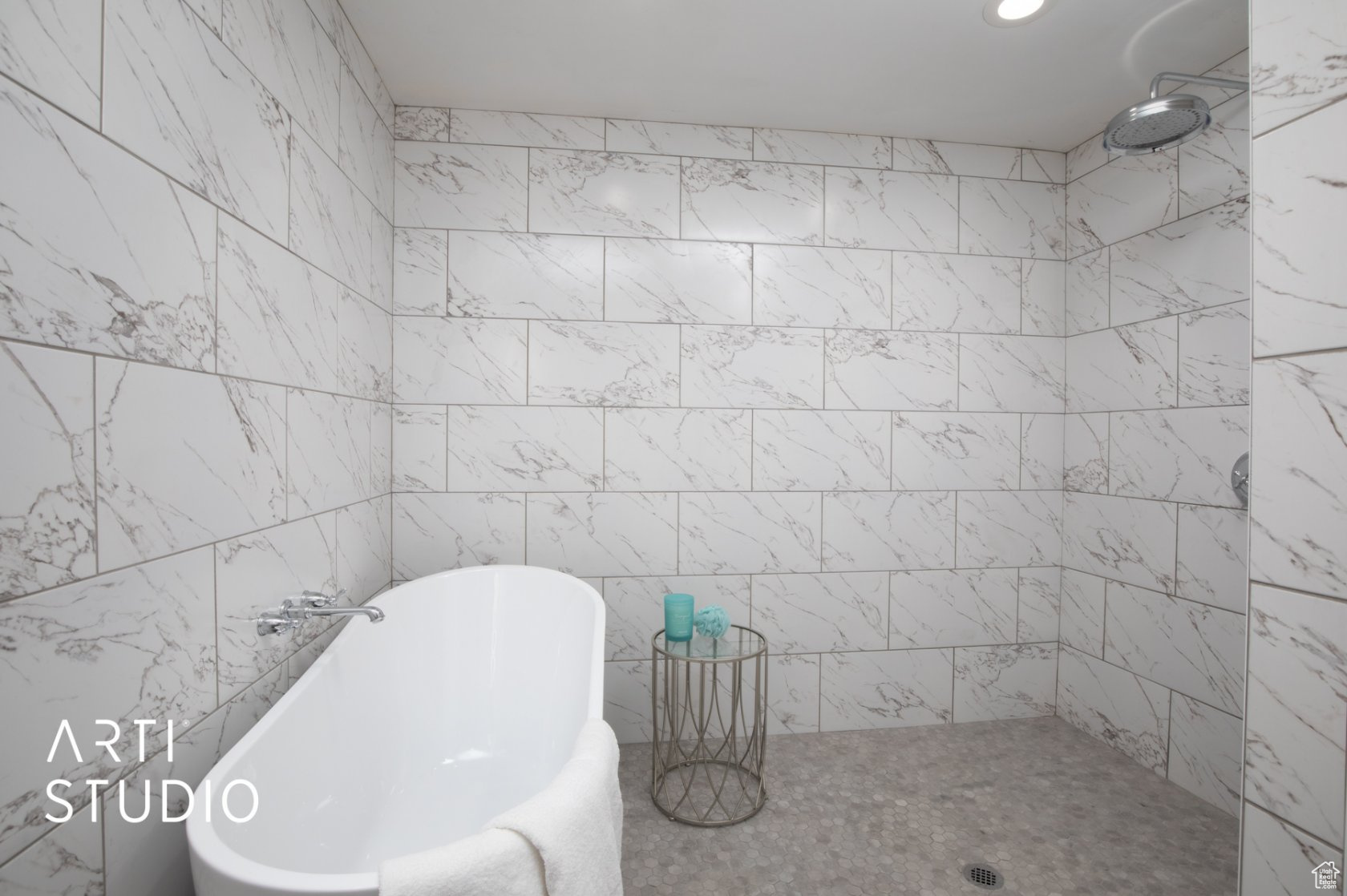 Bathroom featuring a tiled wetroom with a soaking tub