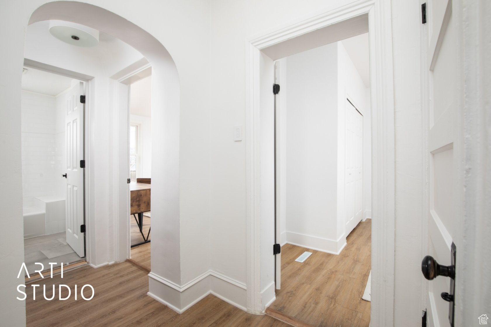 Corridor featuring light wood-type flooring