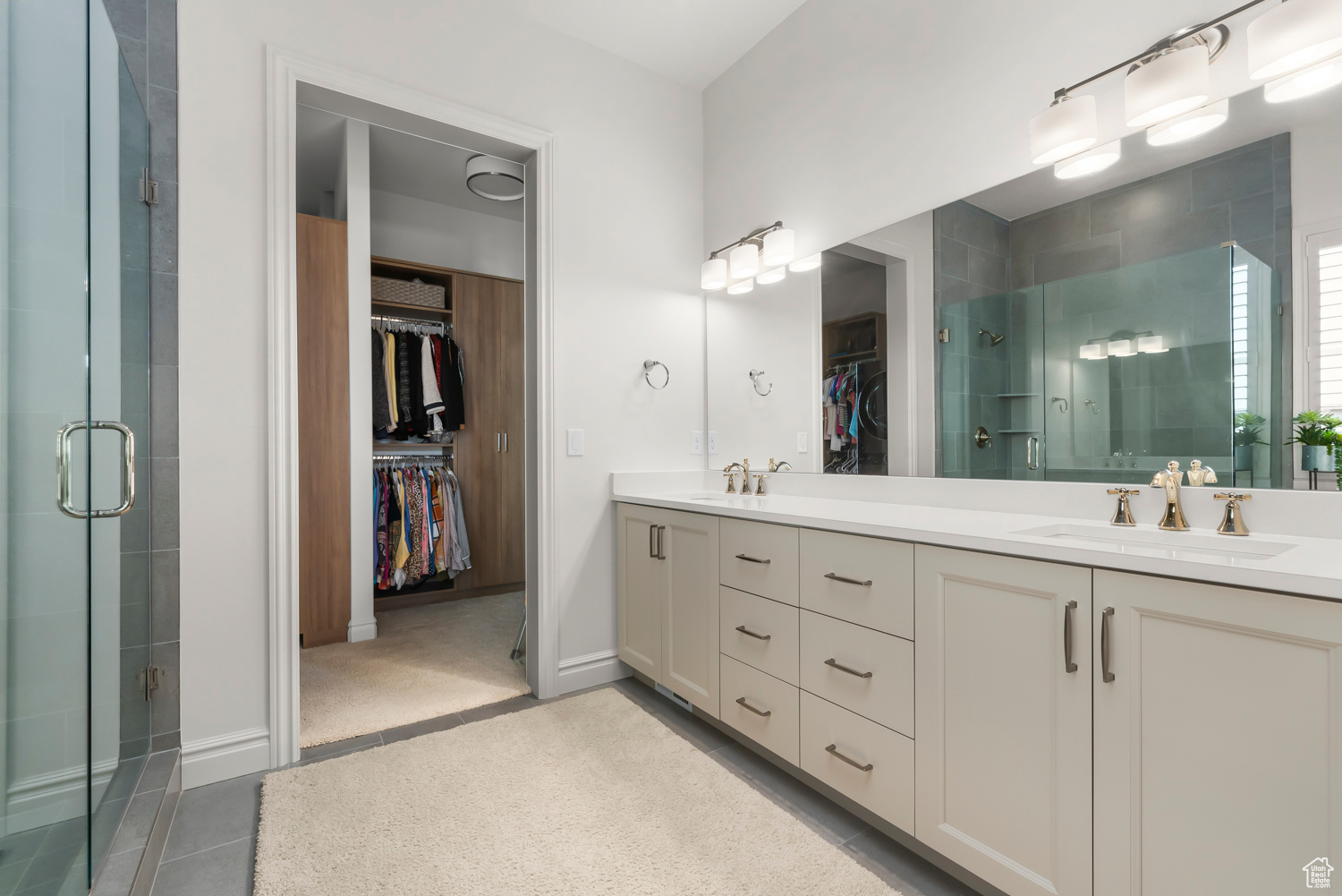 Owner's private bathroom with hardwood / wood-style floors and double vanity