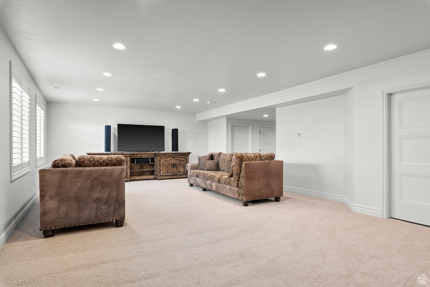 View of spacious carpeted living room