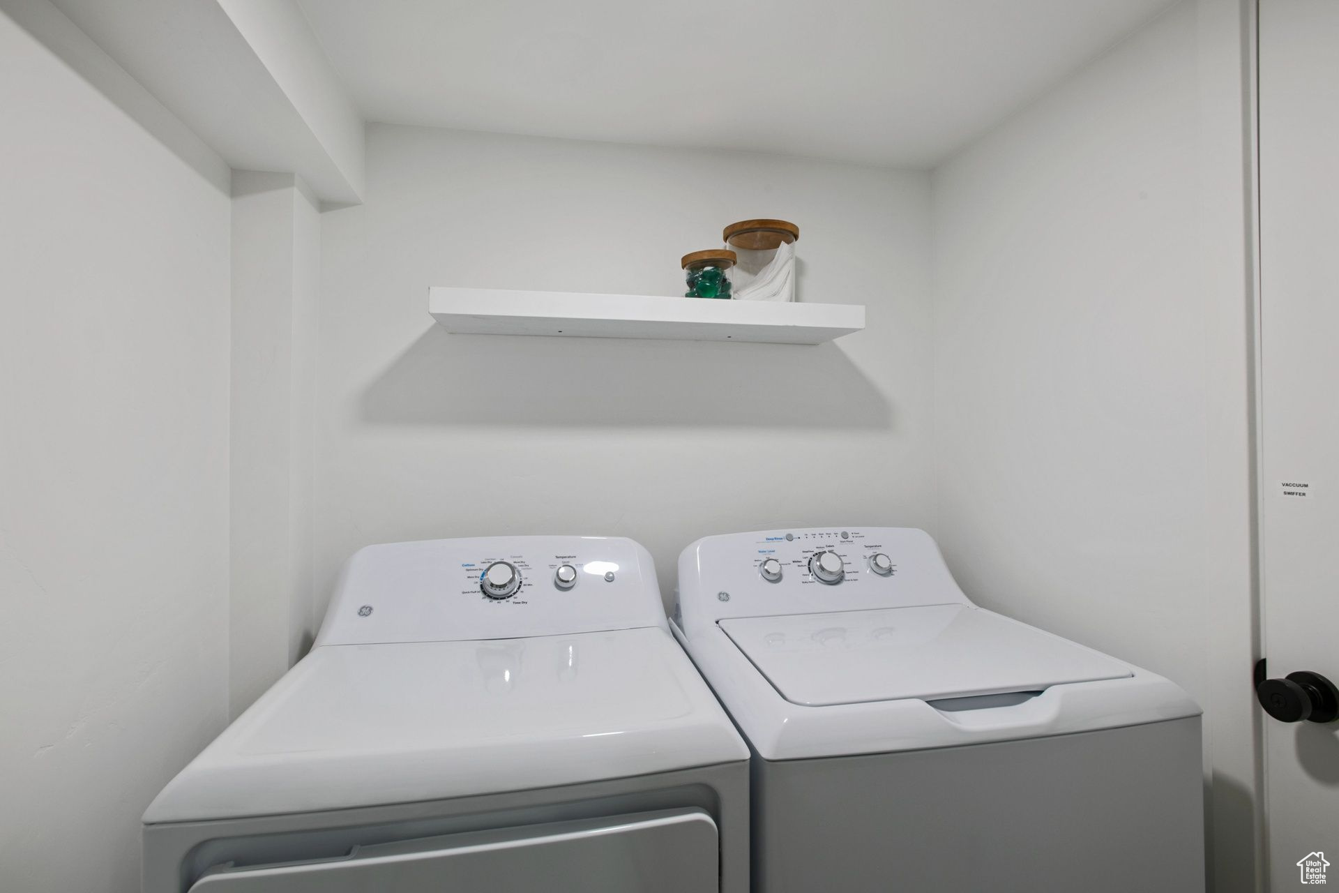 Laundry area featuring washing machine and clothes dryer