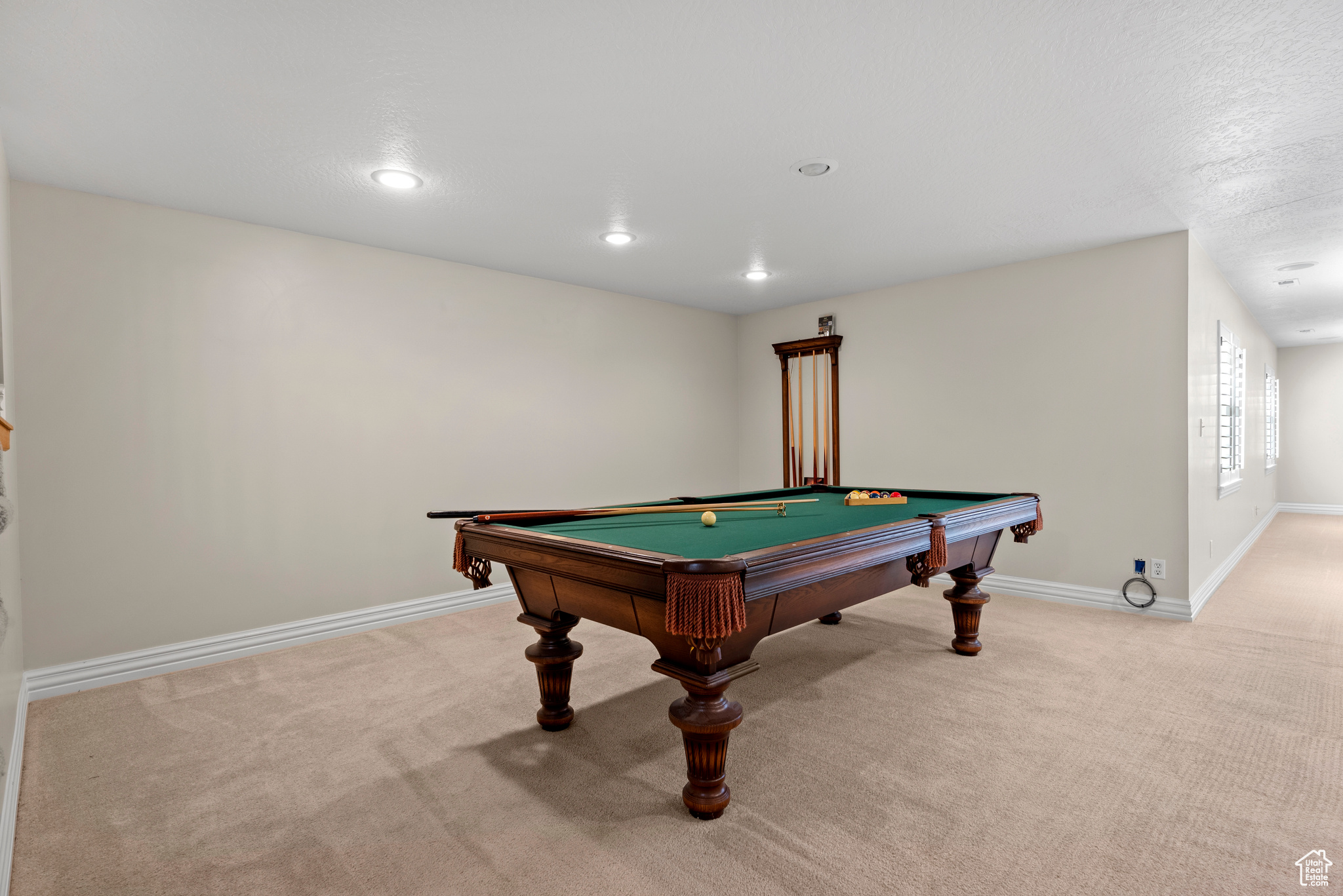 Family room featuring light carpet and pool table