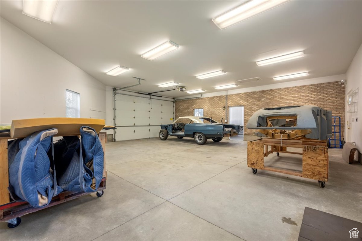 Huge heated attached garage with a 16 foot garage door.