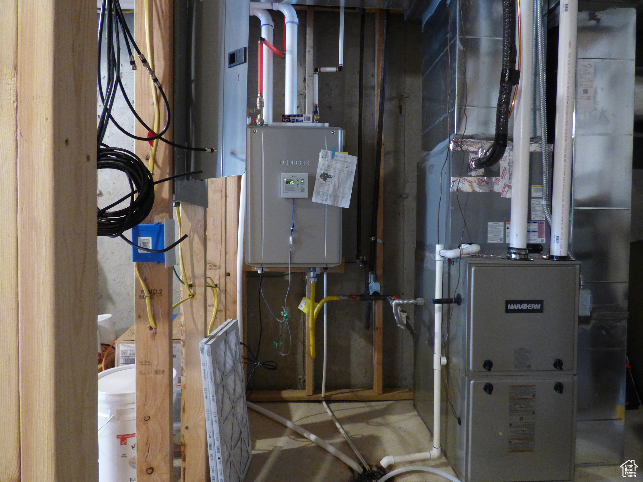 Basement mechanical room with tankless water heater