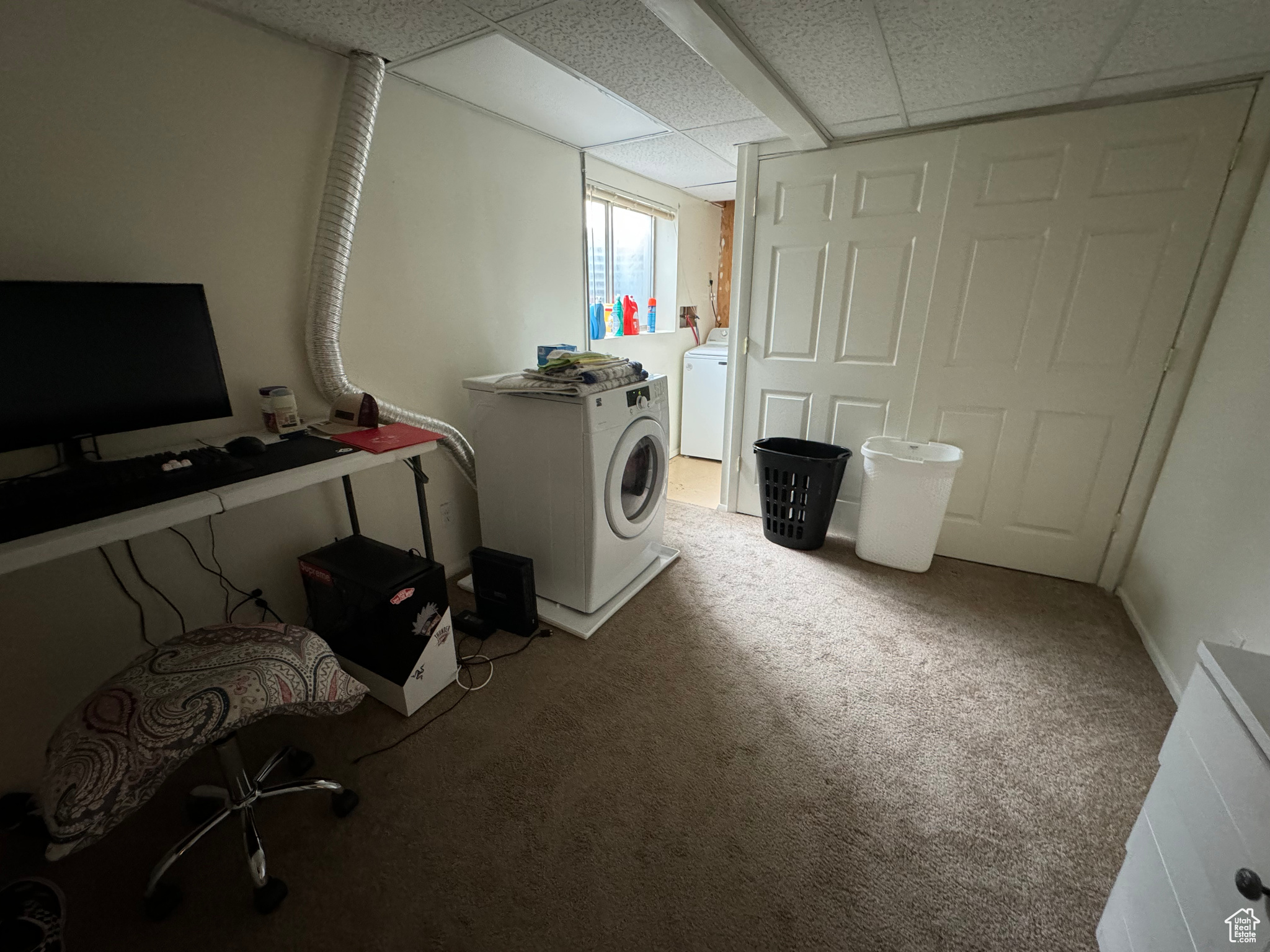 Interior space with carpet floors and washer / dryer