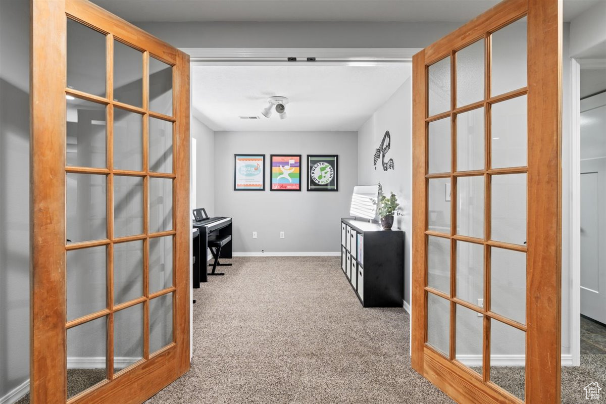 Office space with french doors and carpet