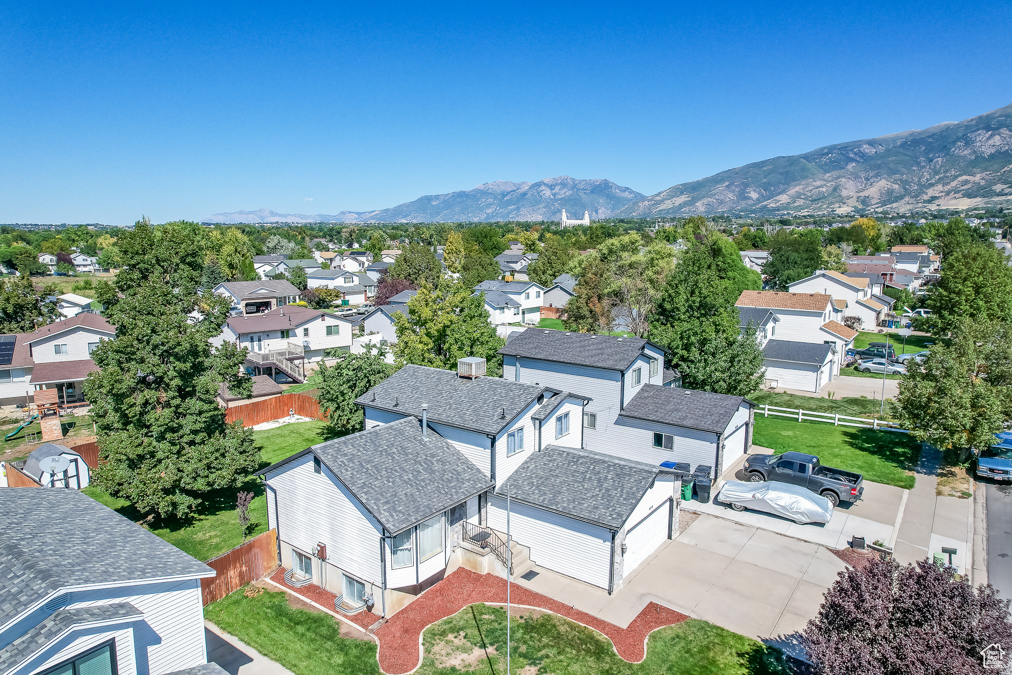 Birds eye view of property with a mountain view