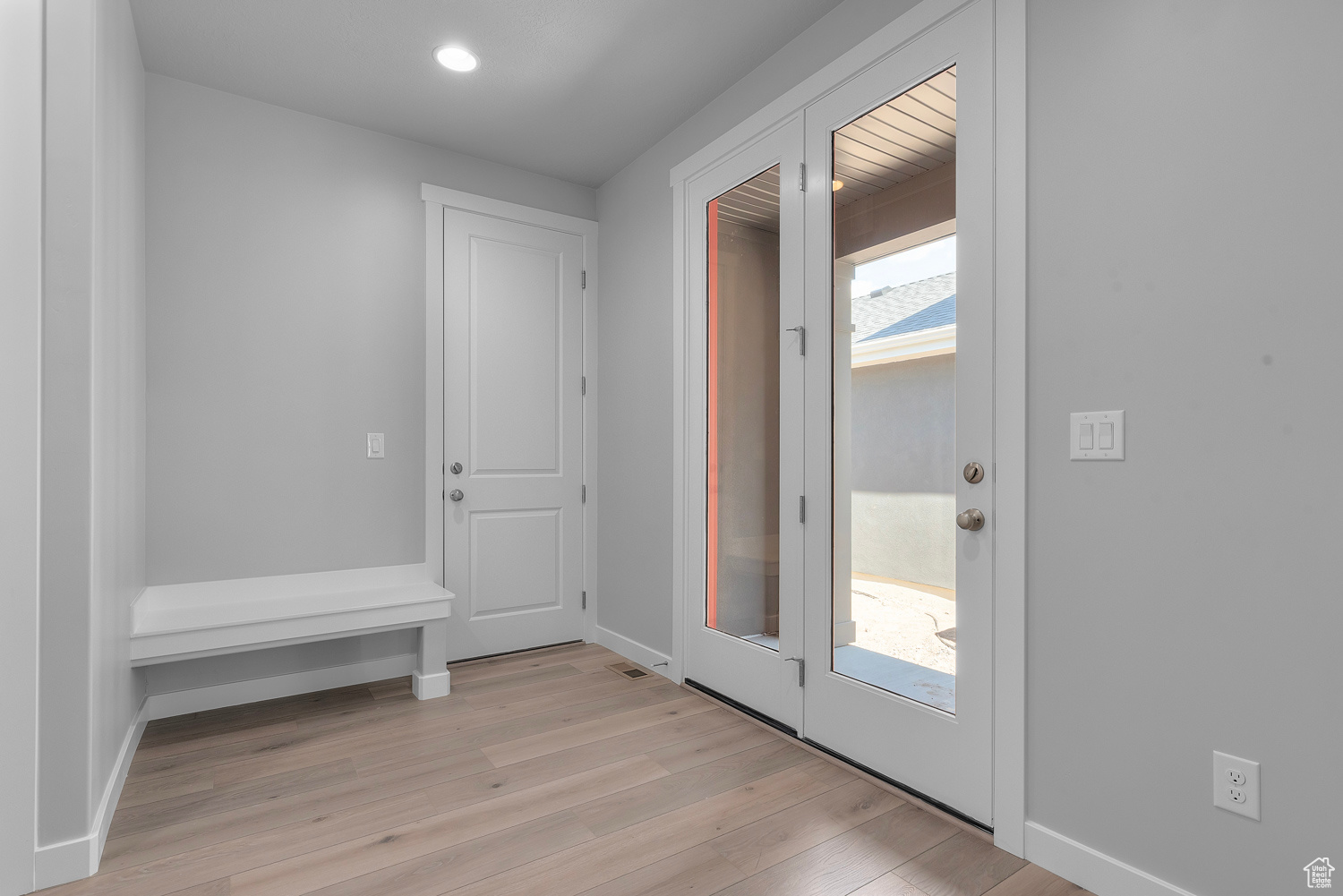 Entryway featuring a healthy amount of sunlight and light hardwood / wood-style flooring