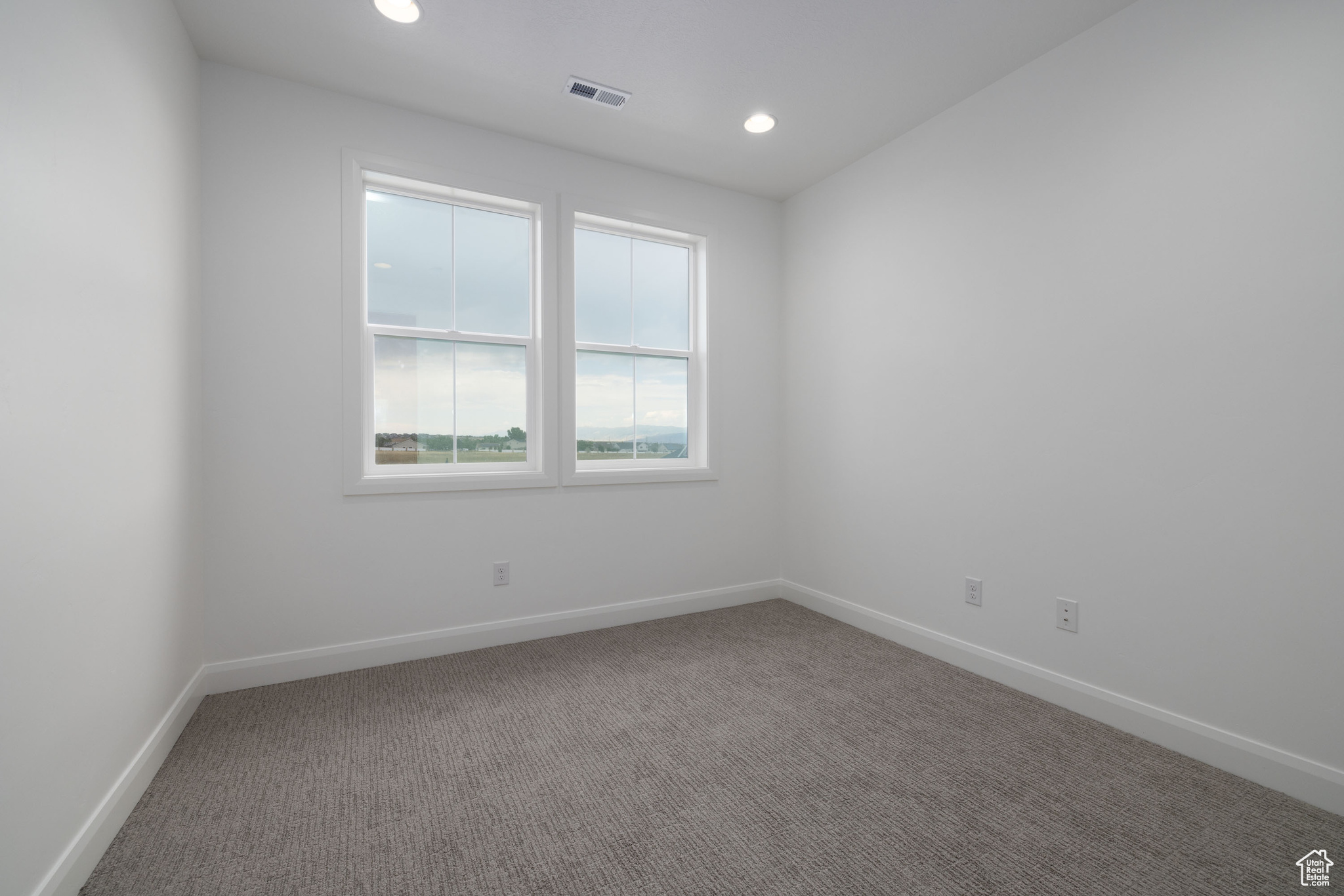 Empty room with carpet flooring