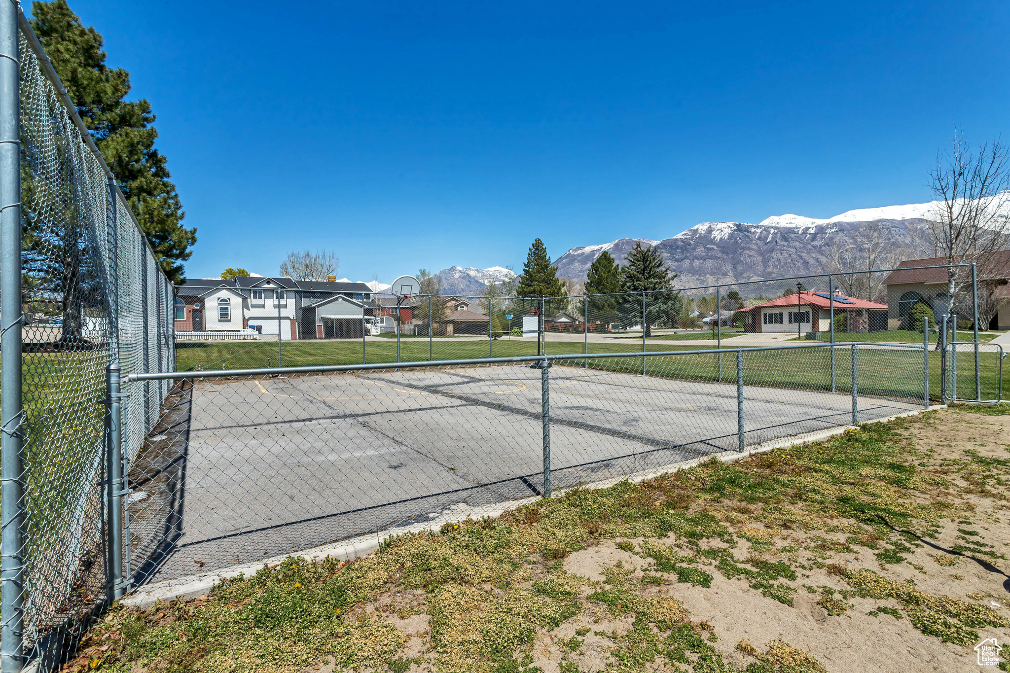 Private neighborhood park boasting mountain views, a playground, pavillion and sport court