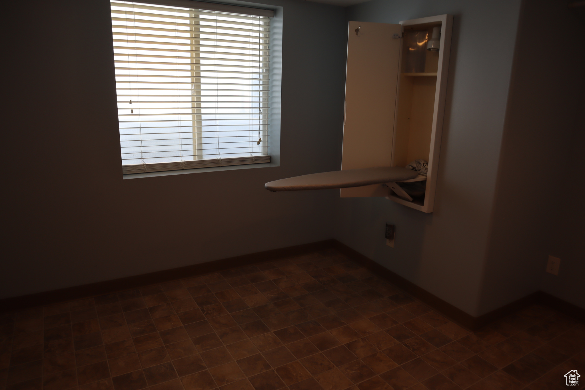 Unfurnished bedroom featuring tile flooring