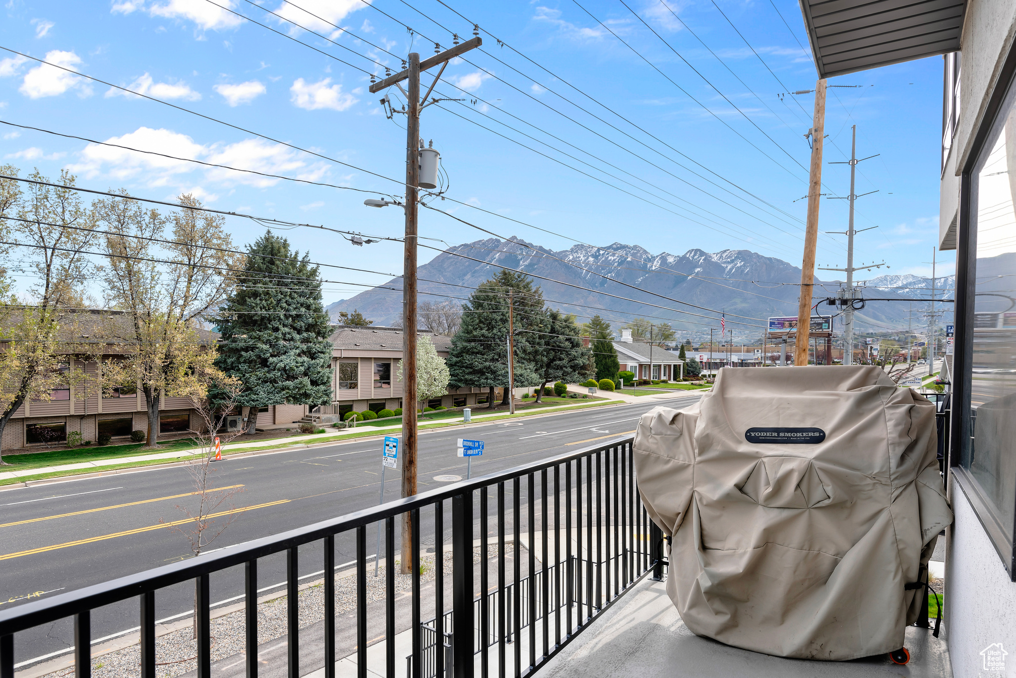 Balcony featuring a mountain view and grilling area