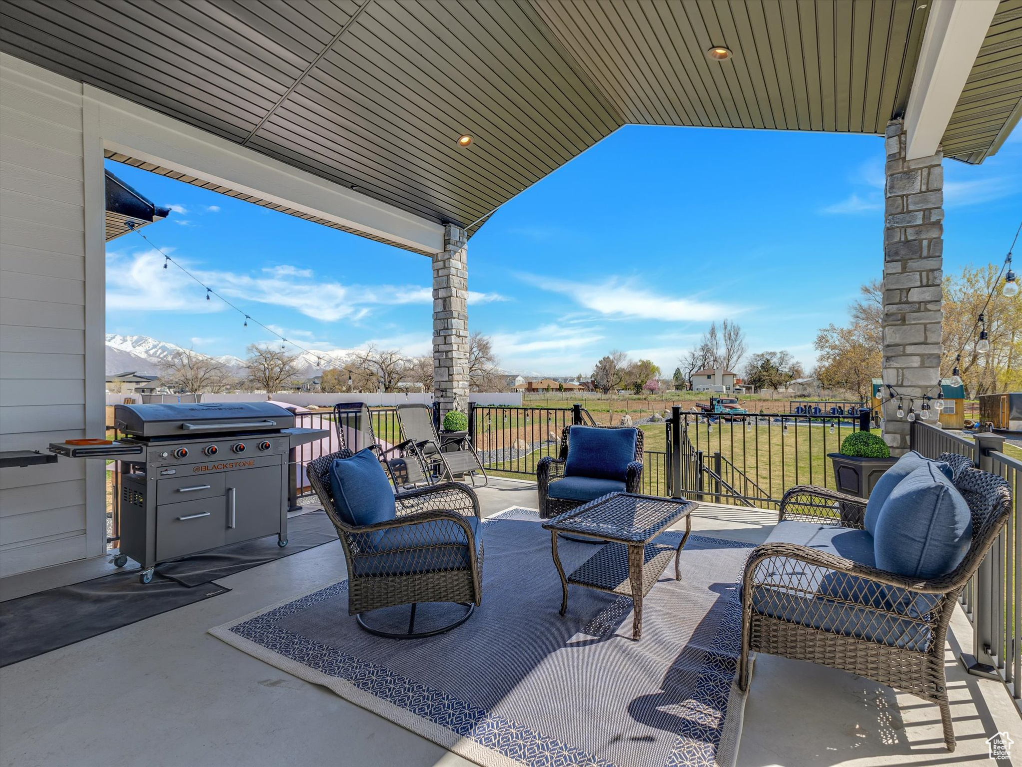 View of covered deck featuring an outdoor living space