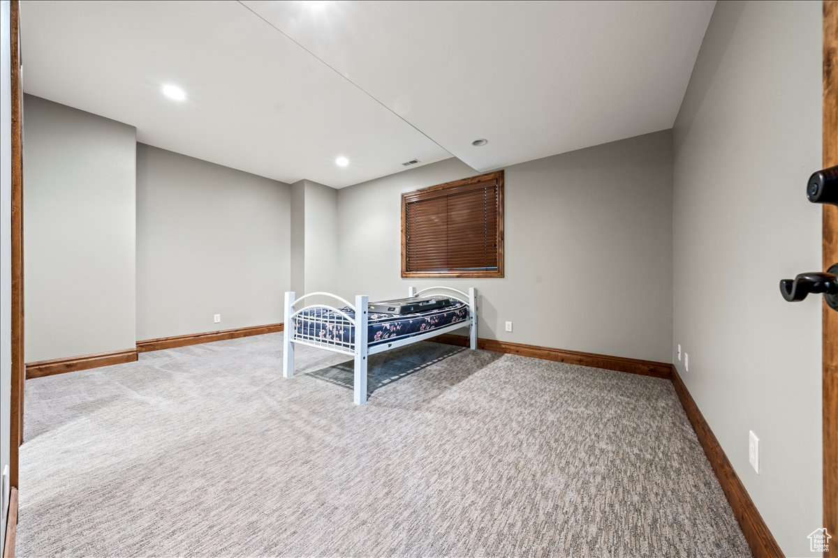 Unfurnished bedroom featuring carpet floors