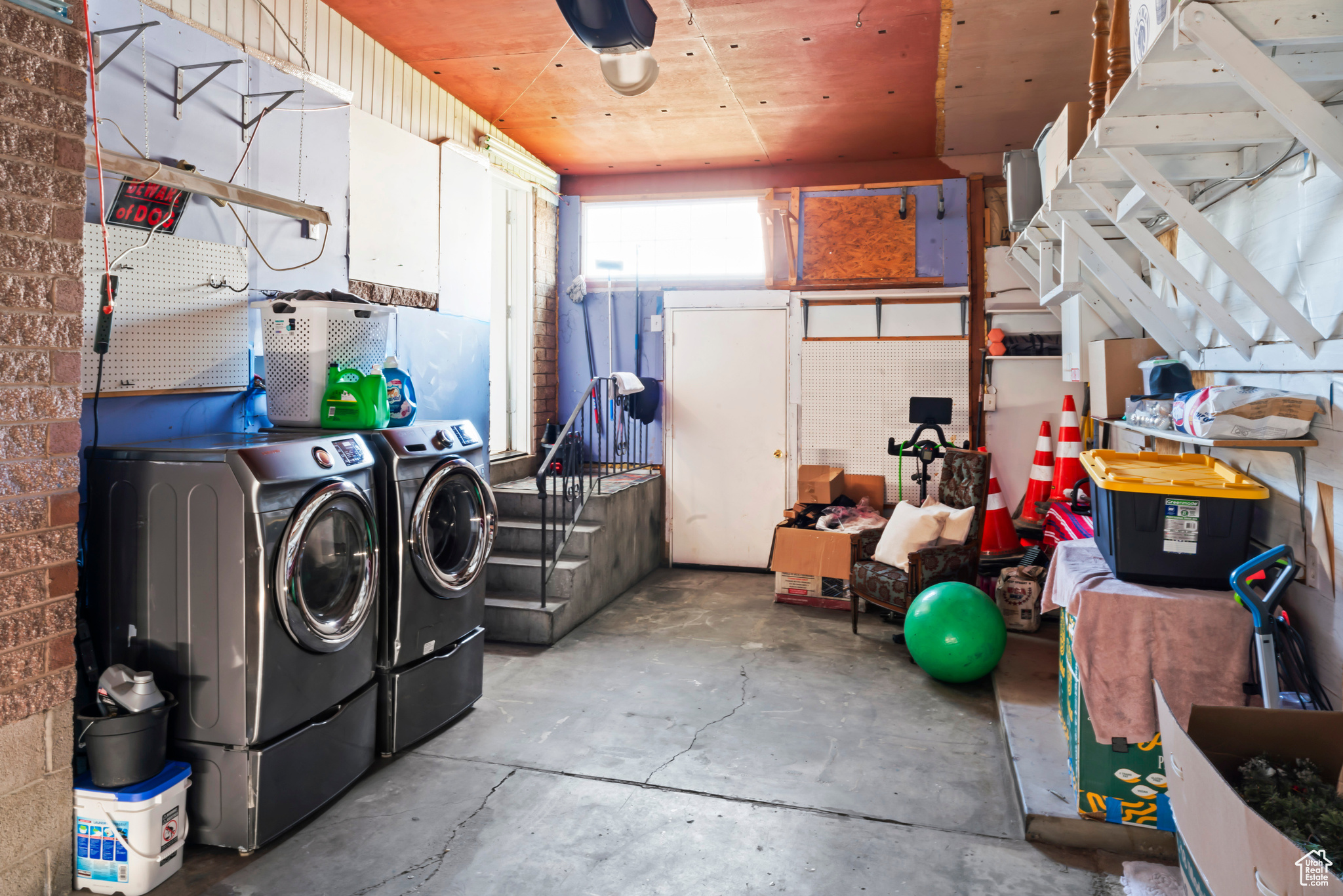 Interior space with wood ceiling and washer and clothes dryer