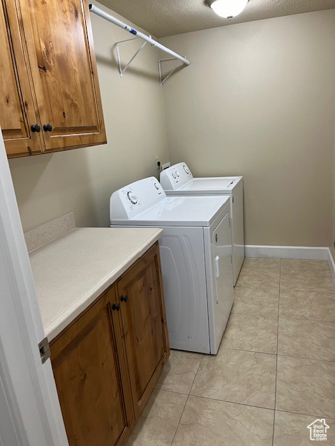 Nice laundry room with cabinets and countertop