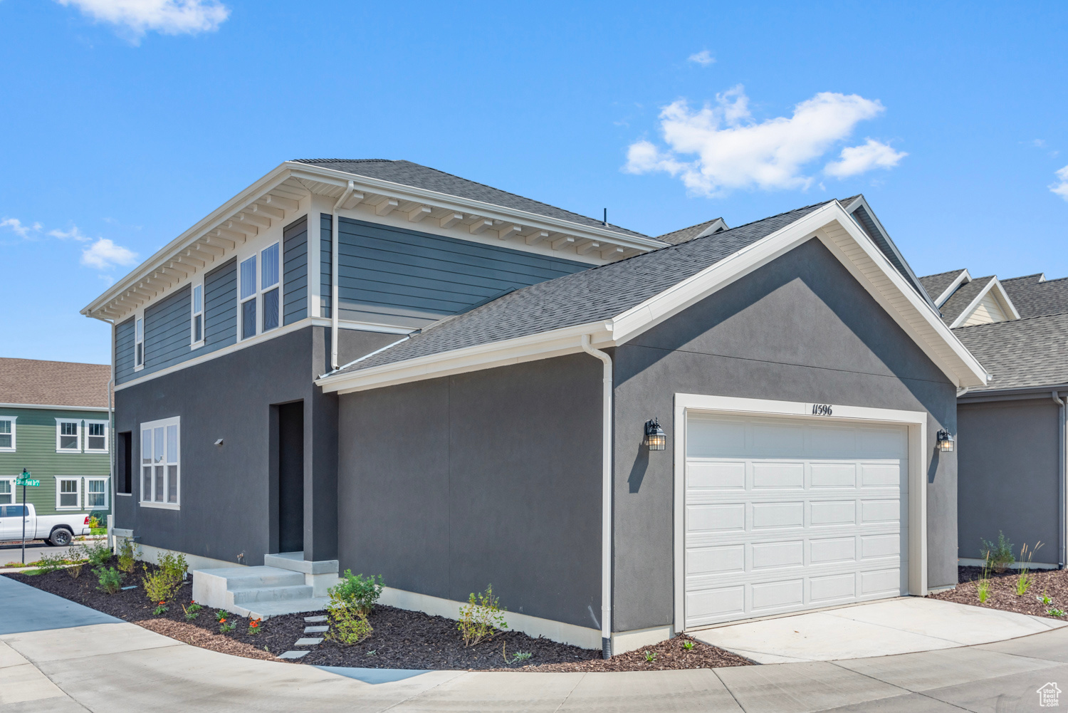 View of rear facade featuring a garage