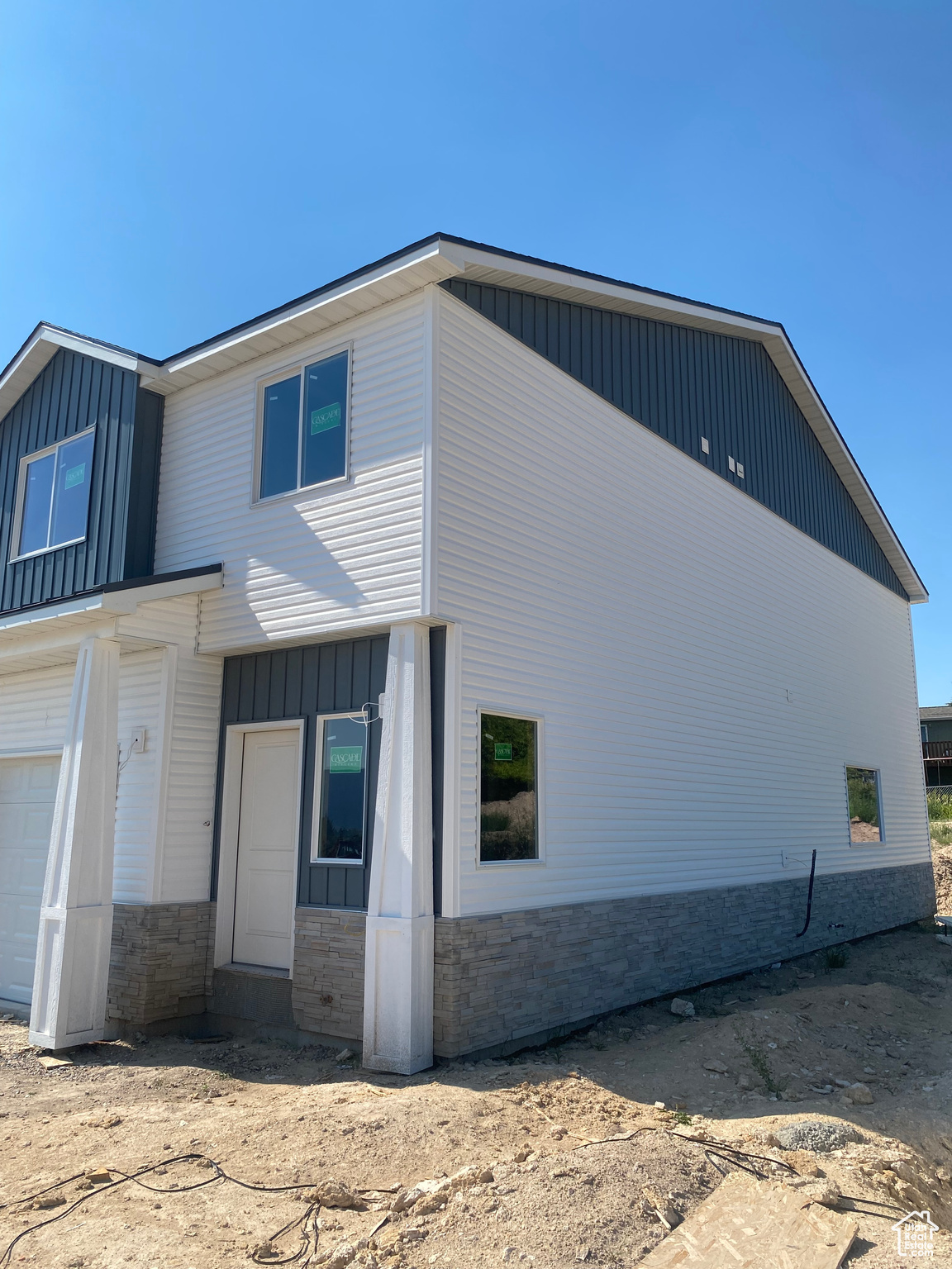 View of side of home featuring a garage