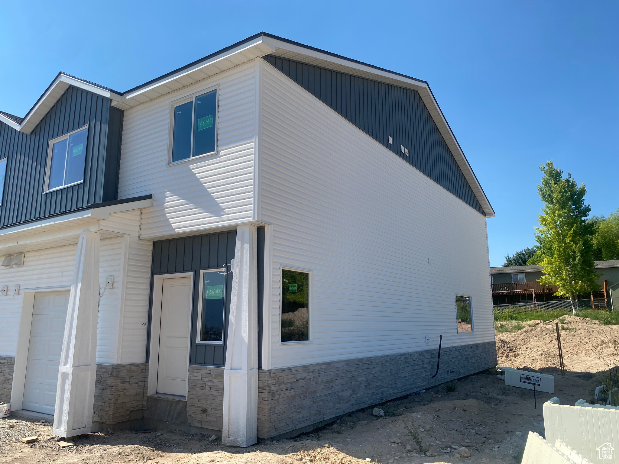 View of property exterior featuring a garage