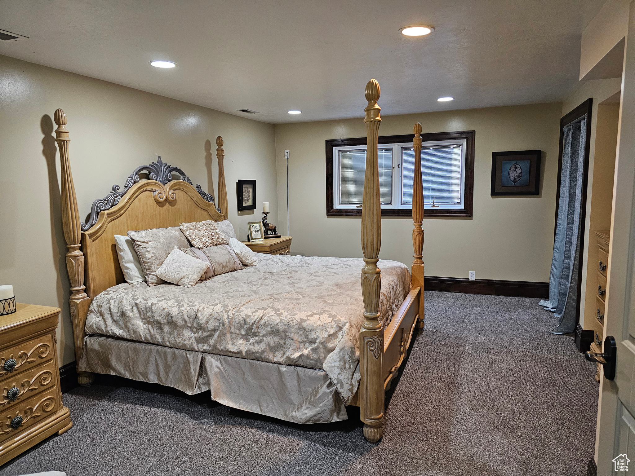 Bedroom featuring dark carpet