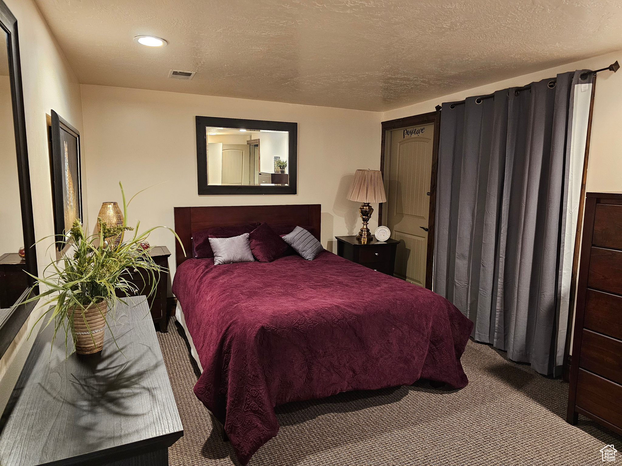 CASITA-Carpeted bedroom with a textured ceiling