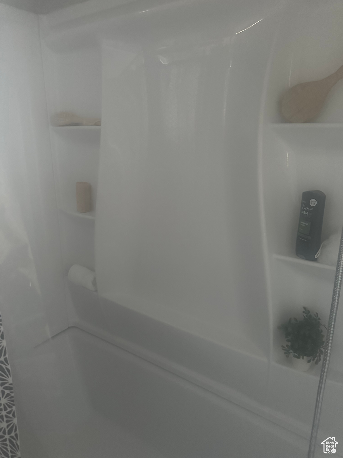 Room details featuring shower / bathing tub combination