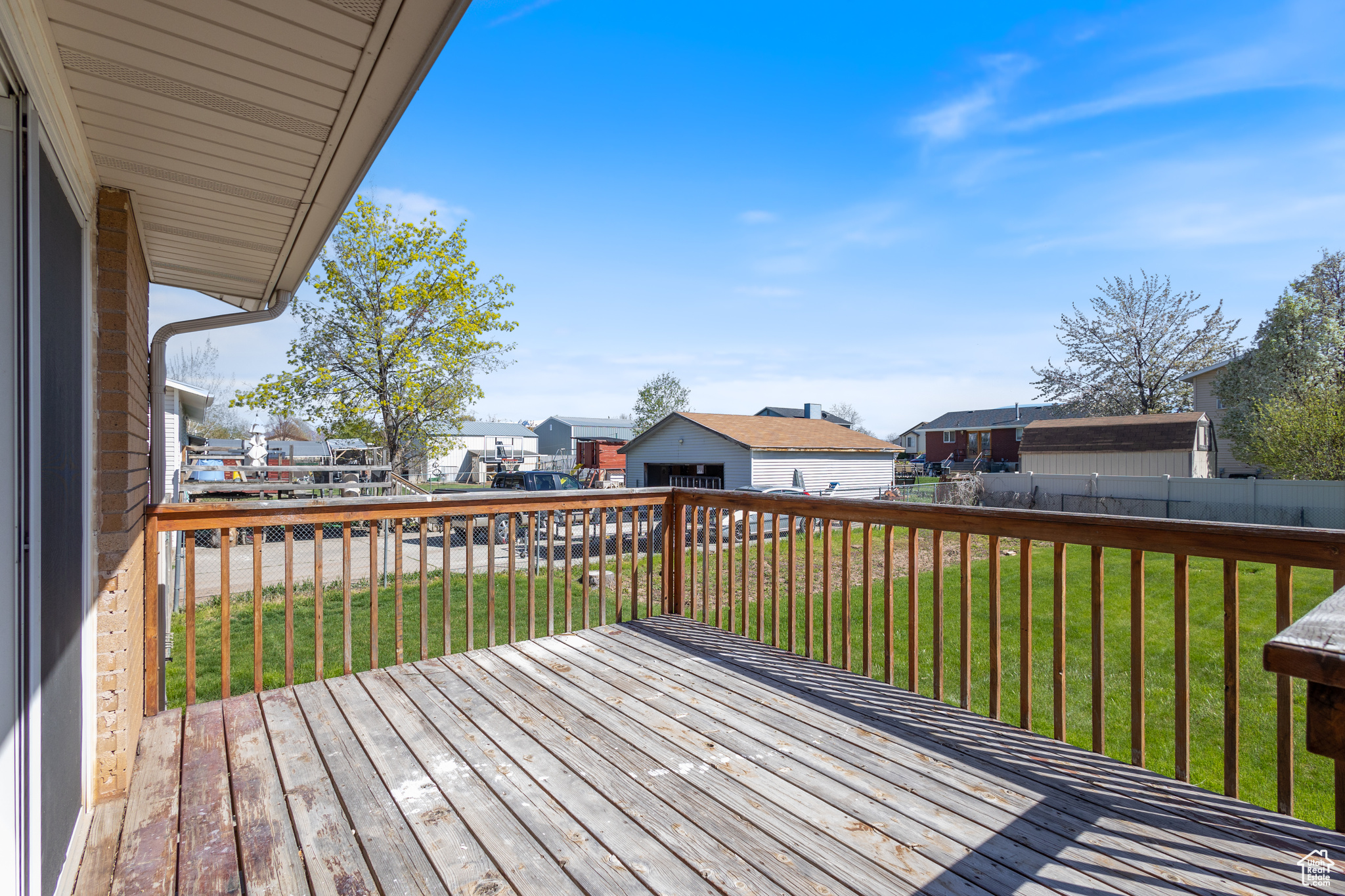 Wooden deck with large yard