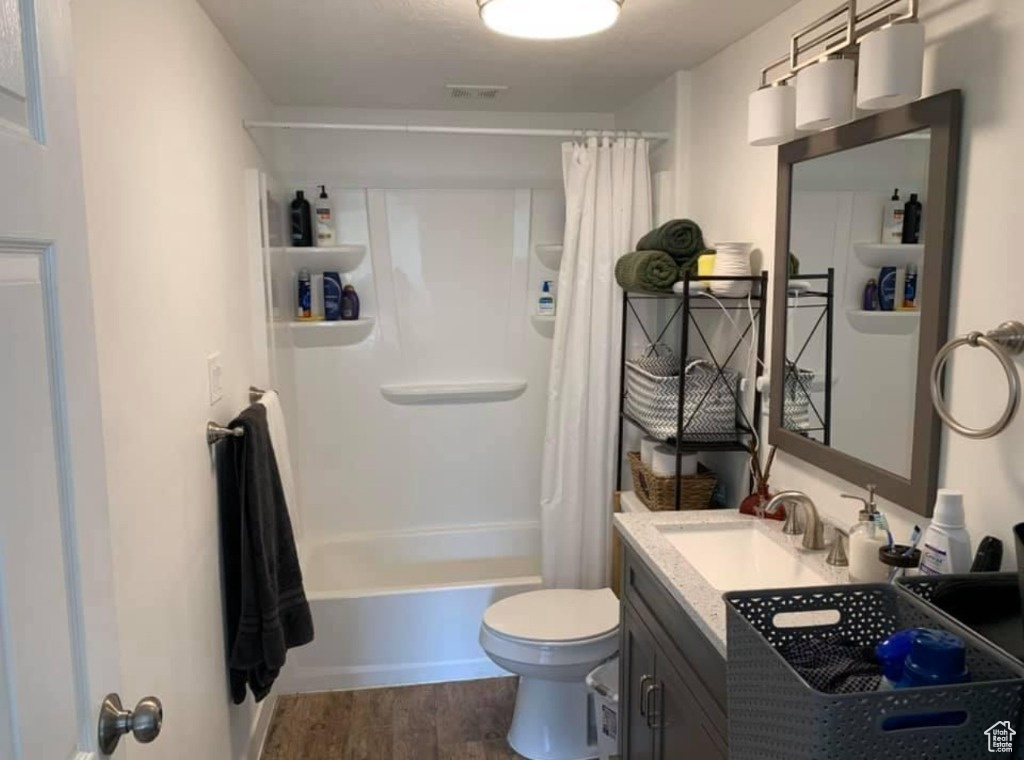 Full bathroom with in-suite laundry in the downstairs unit