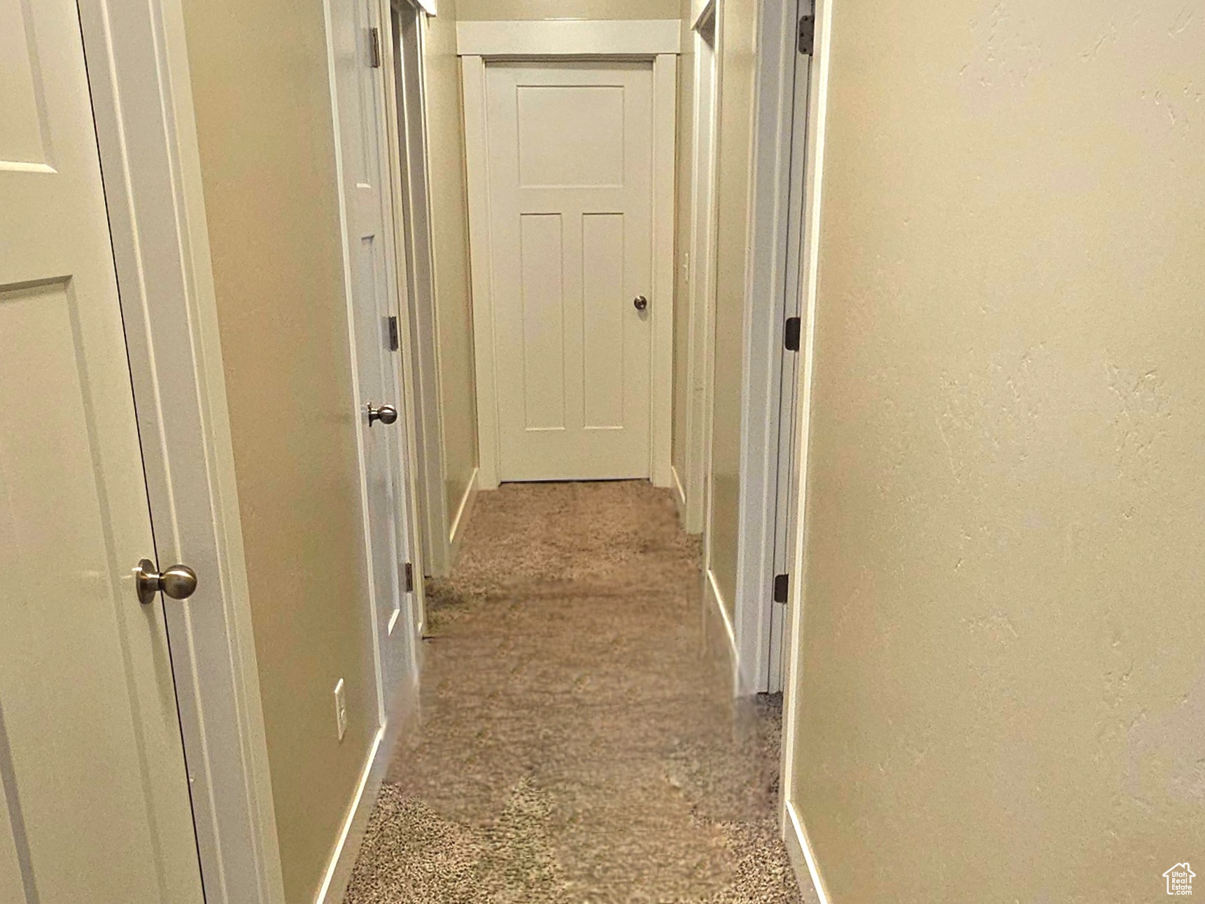 Corridor with carpet flooring