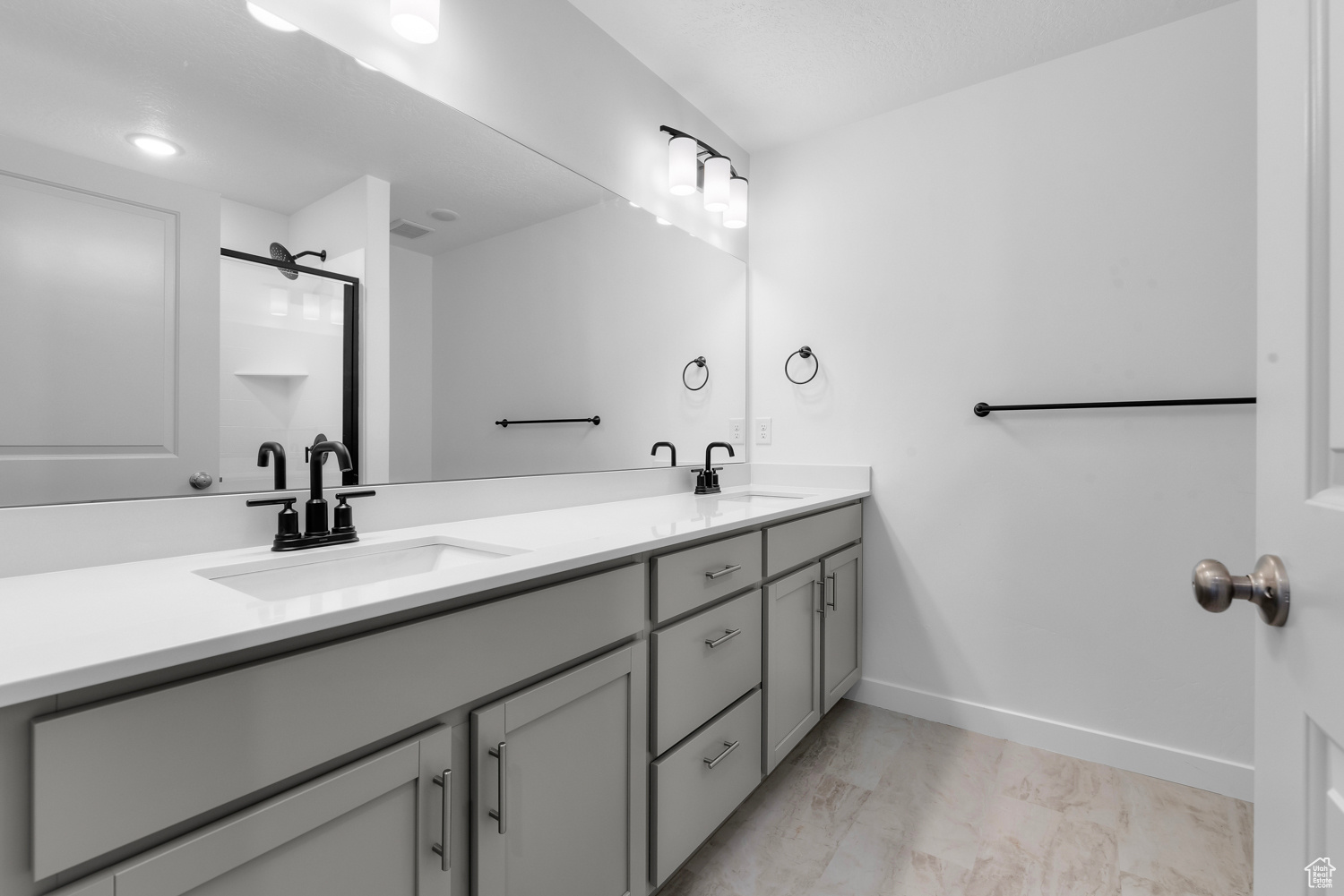 Bathroom featuring dual vanity